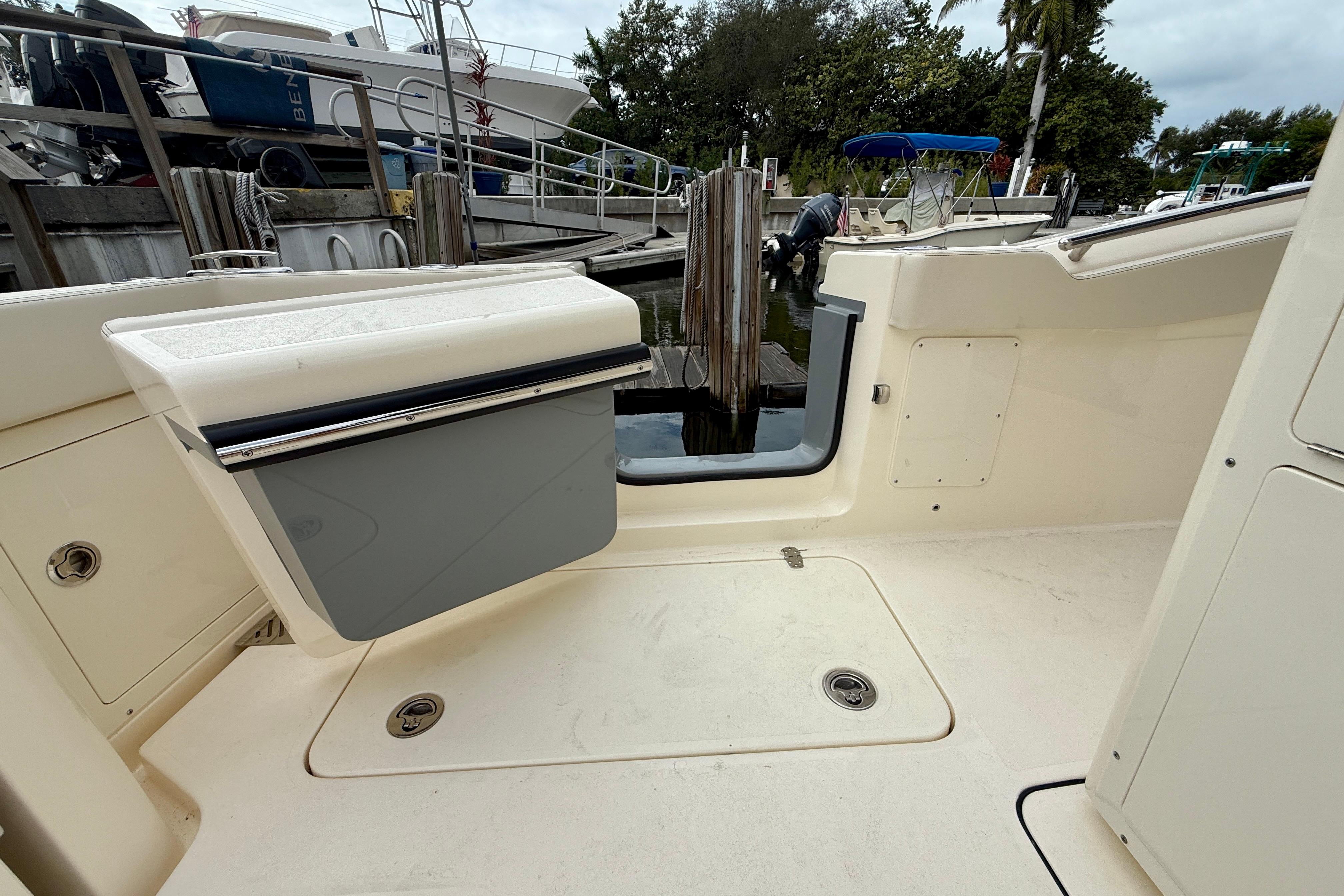 2026 Scout 288 LXF boat interior with open hatch, docked at marina.