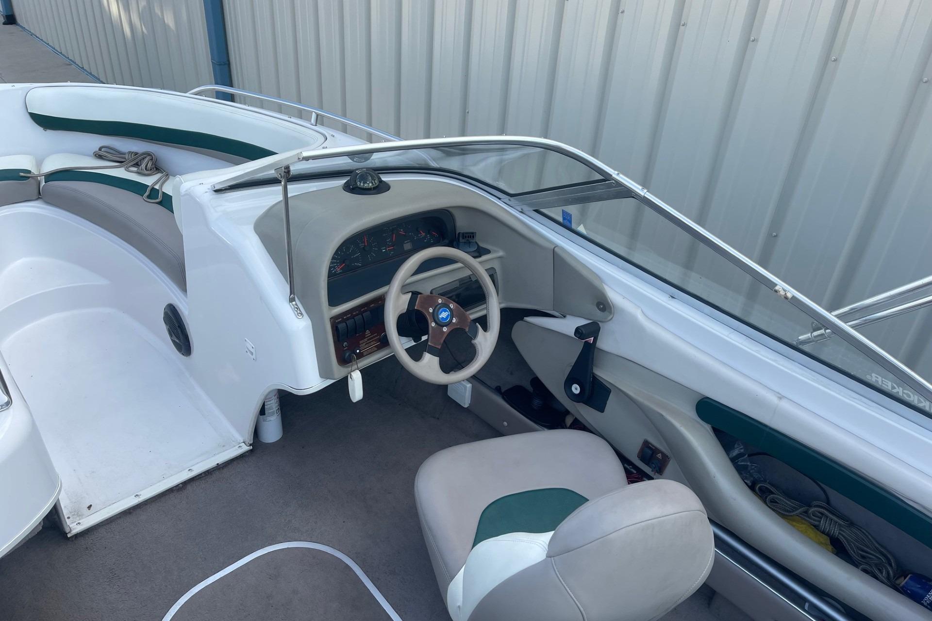 1996 Four Winns 200 Horizon boat interior with steering wheel and seating.