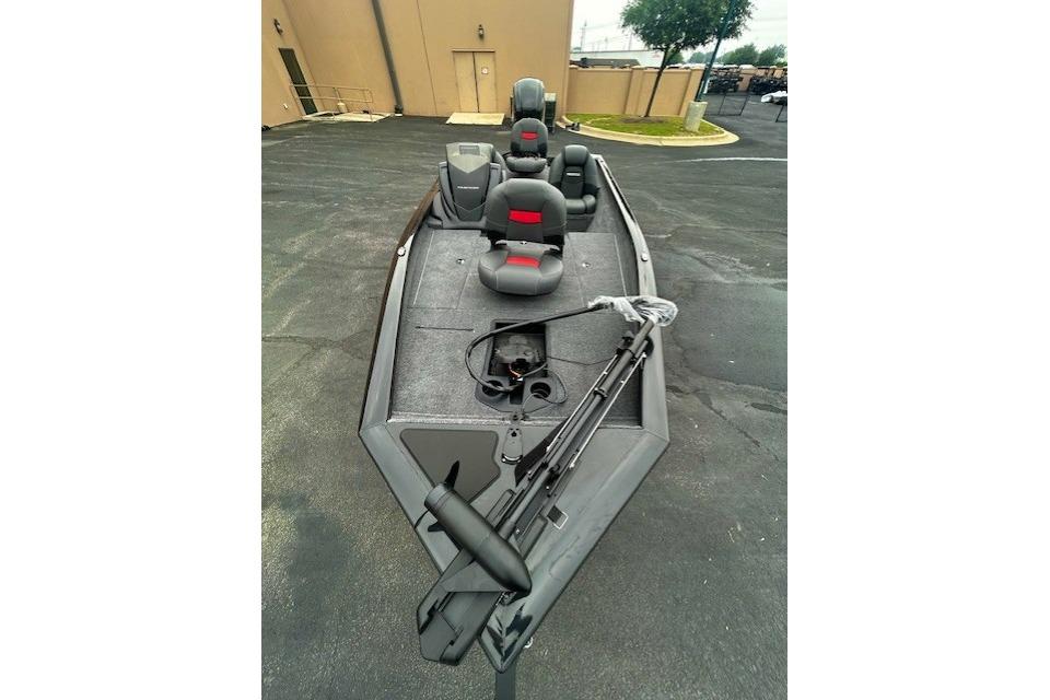 2026 Tracker Pro Team 175 boat with seating and fishing equipment on display.