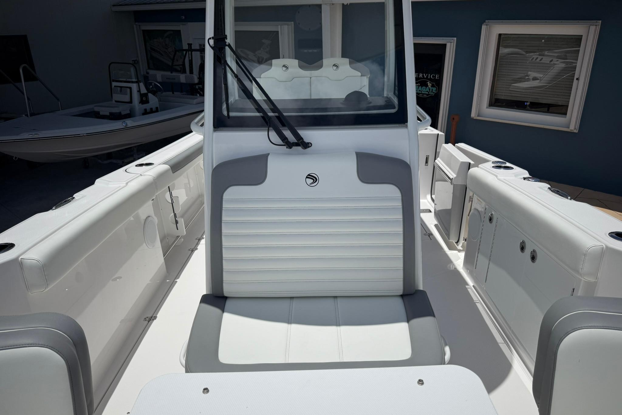2026 Edgewater 250CC boat interior with sleek white seating and modern design.