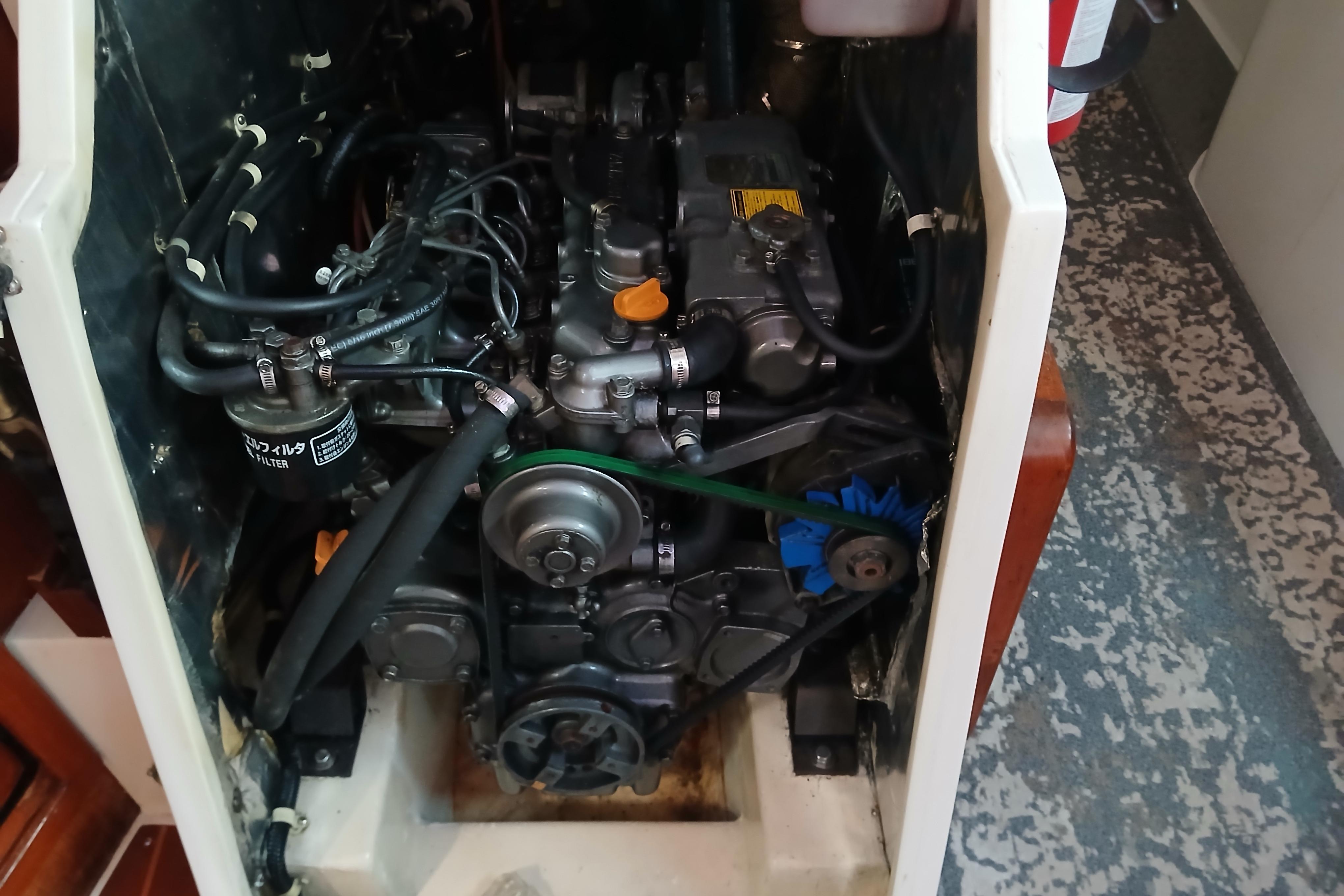 Engine compartment of a 1995 Catalina 42 MkII sailboat, showcasing mechanical components.
