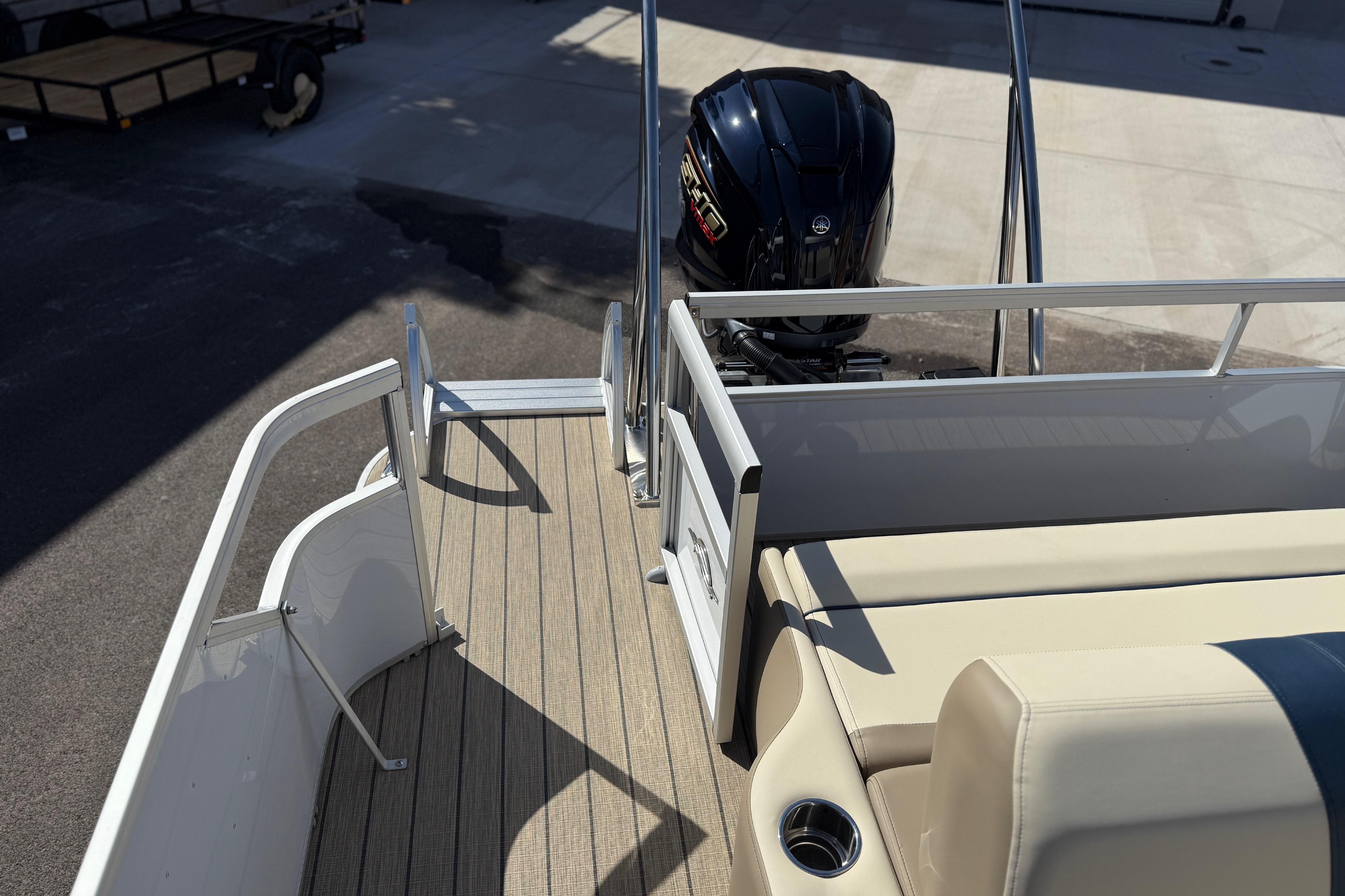2026 SunCatcher Select 322SL pontoon boat with Yamaha outboard motor, beige seating.