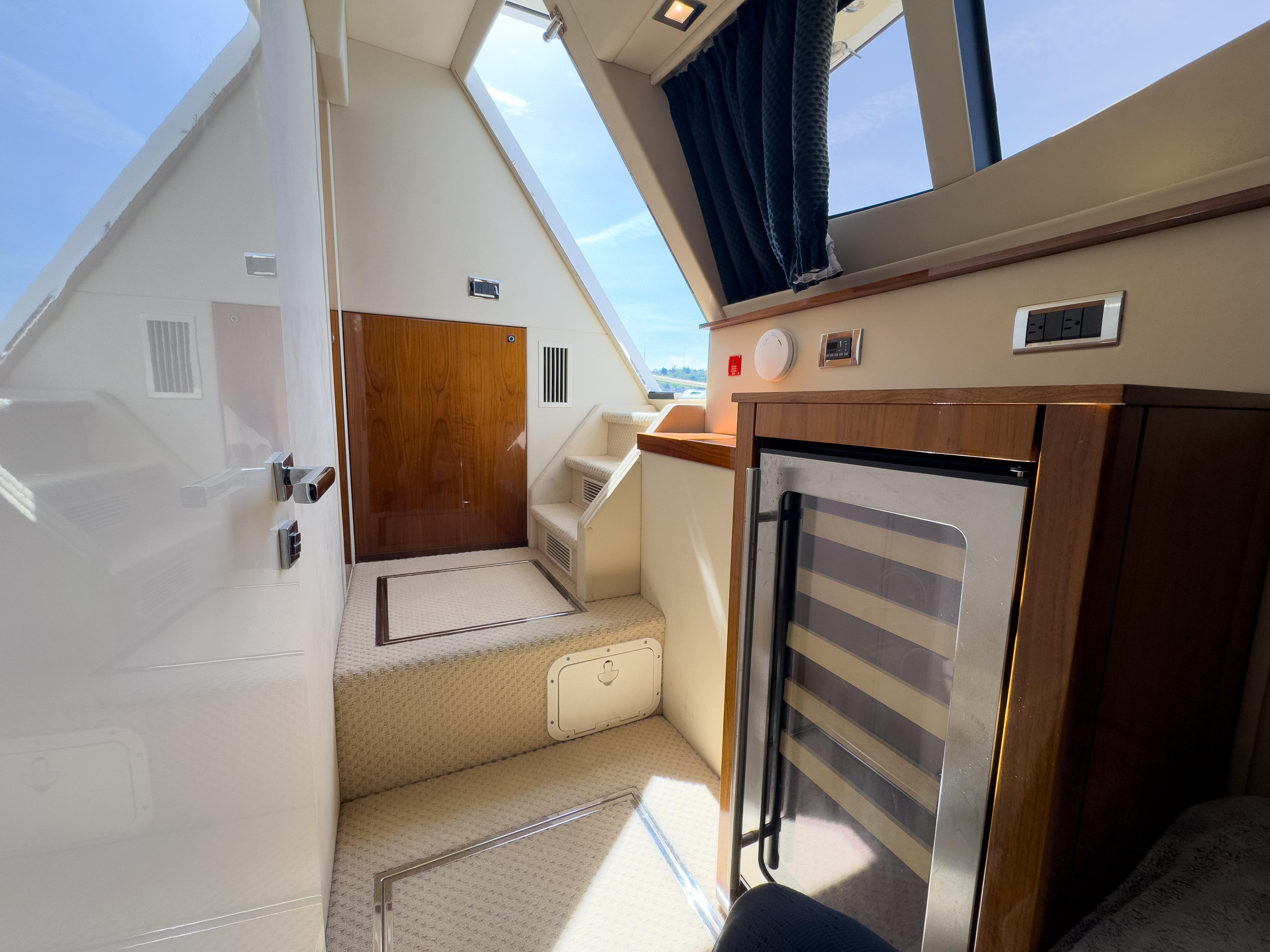 Interior of 2012 Sunseeker Manhattan 63 yacht, featuring modern design and compact amenities.