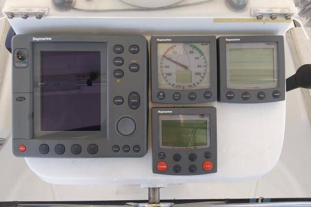Raymarine navigation instruments on a 2005 Beneteau 393 sailboat dashboard.