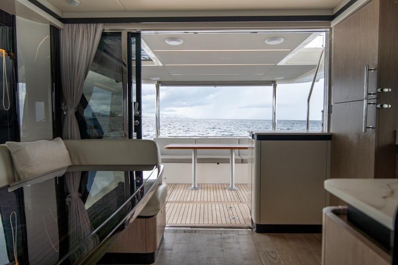 Luxurious interior of 2023 Absolute 62 Fly yacht with ocean view.
