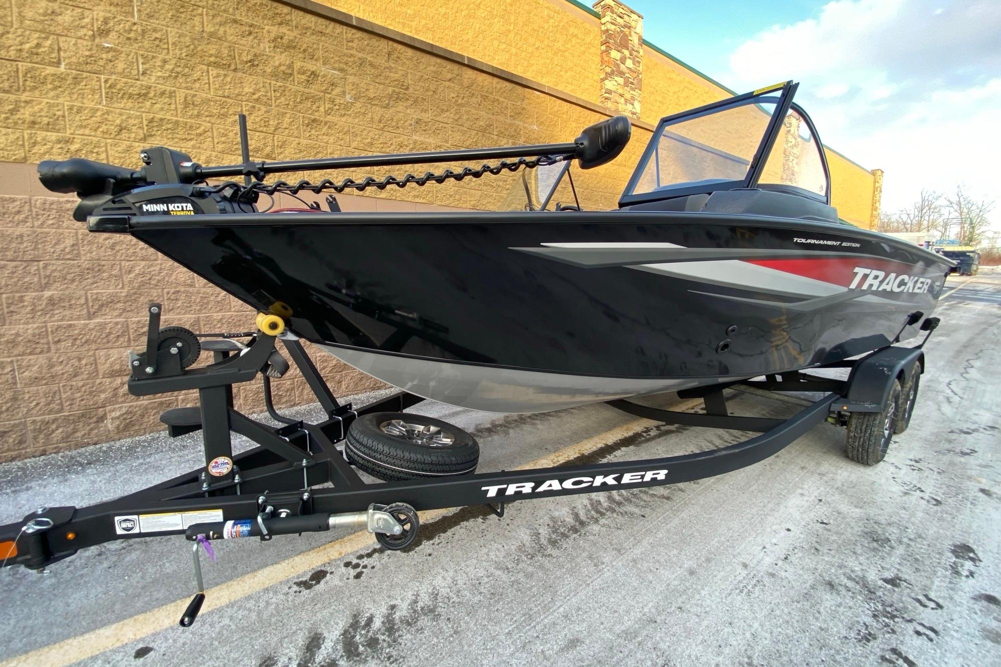 2026 Tracker Targa V-18 Combo boat on trailer, featuring sleek black design.