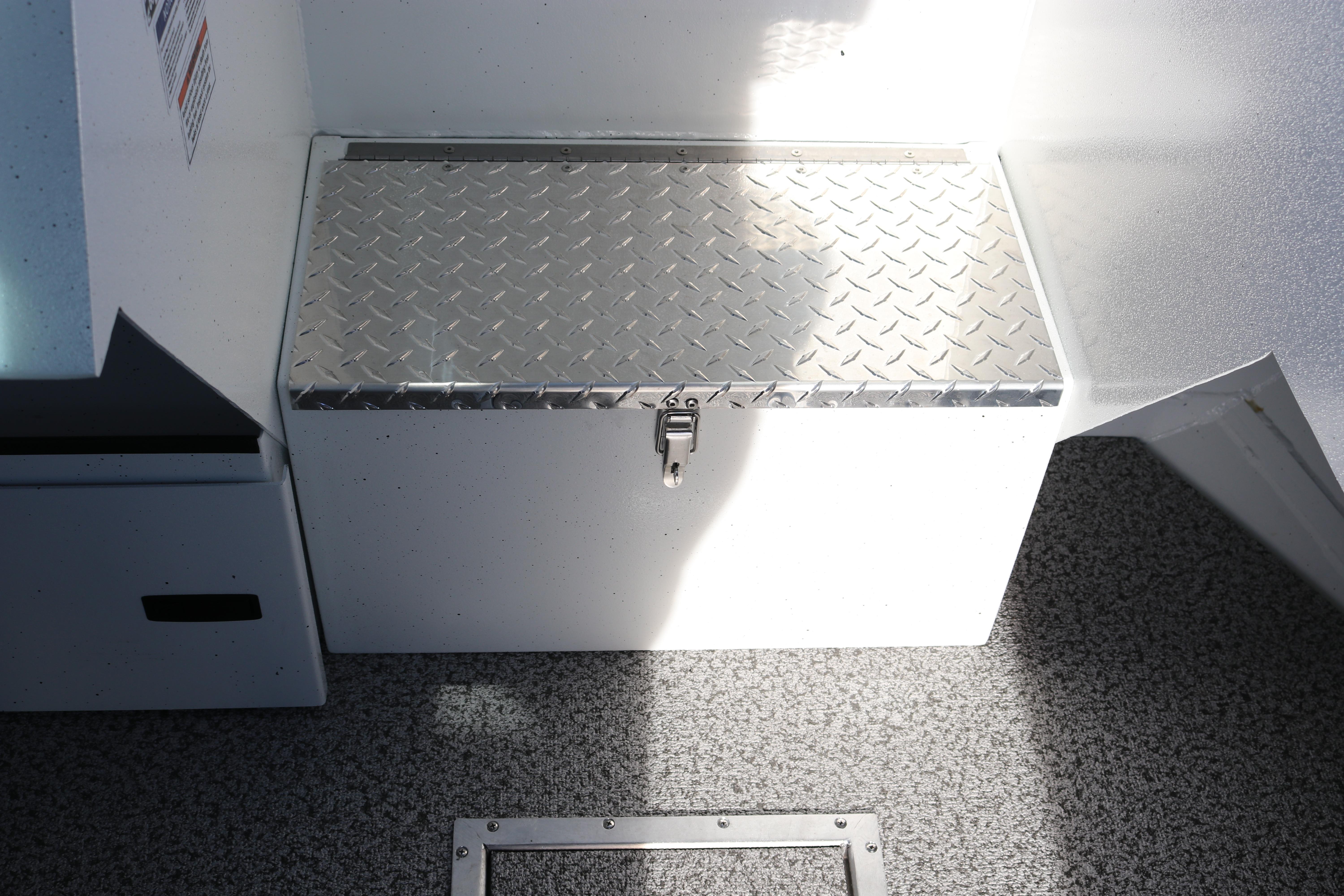 Alumaweld Intruder Outboard 22 (2026) storage compartment with diamond plate lid.