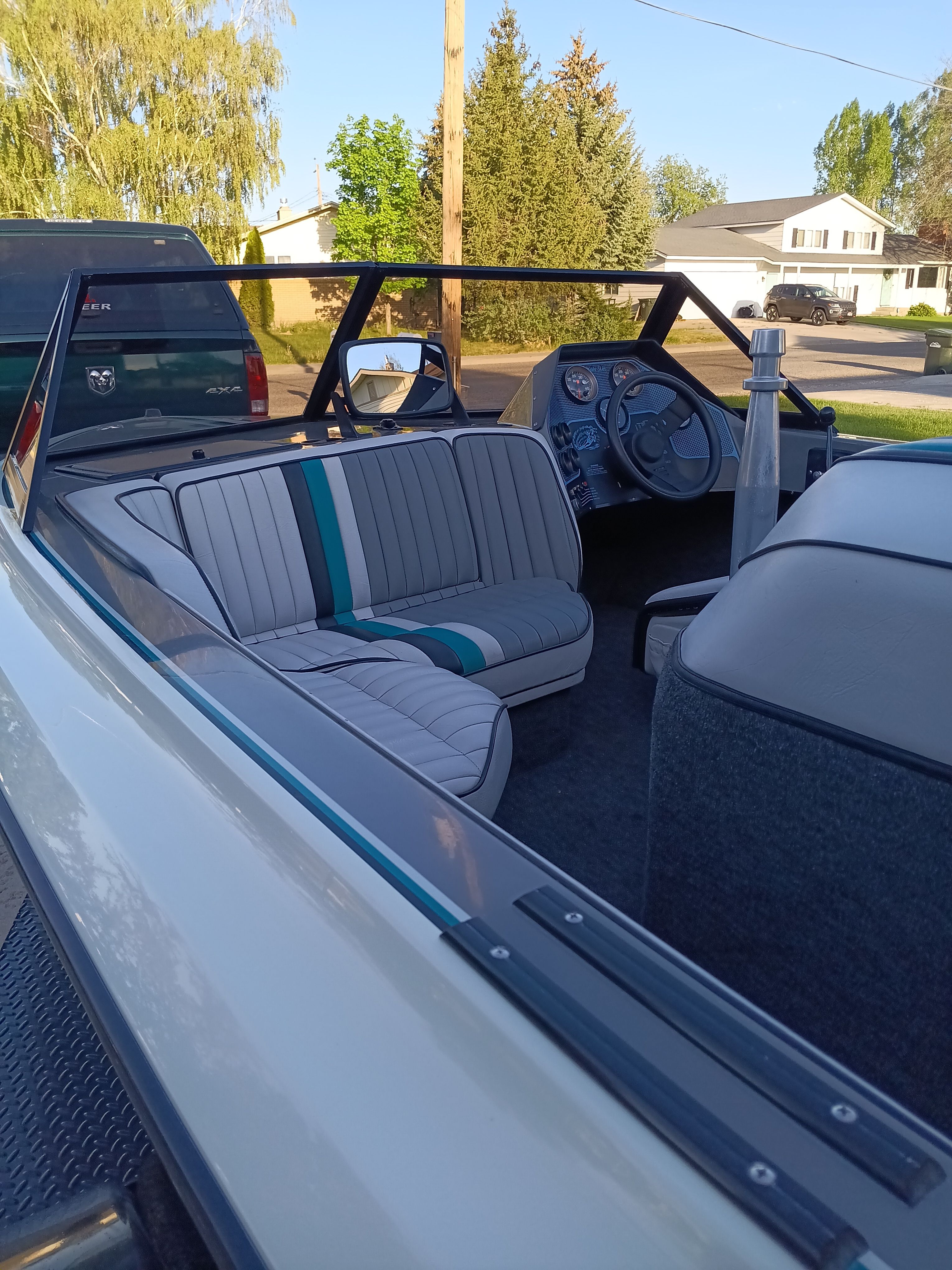 Interior view of a 1991 Malibu Skier boat with gray seats.