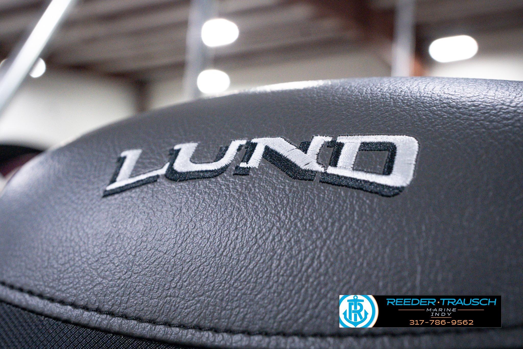 Close-up of 2026 Lund 1875 Impact XS SS boat seat with logo.
