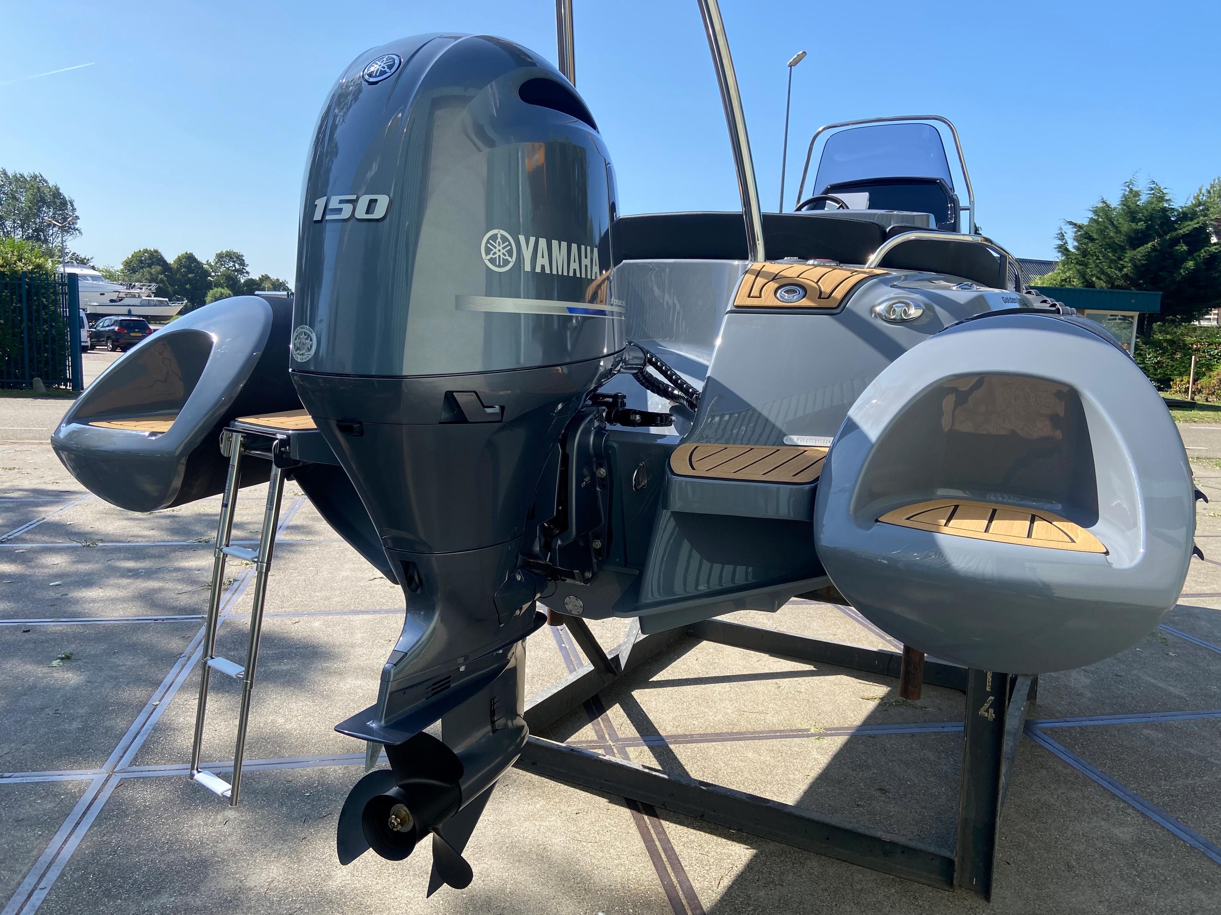 2024 Grand Golden Line 650 boat with Yamaha 150 engine, displayed outdoors.