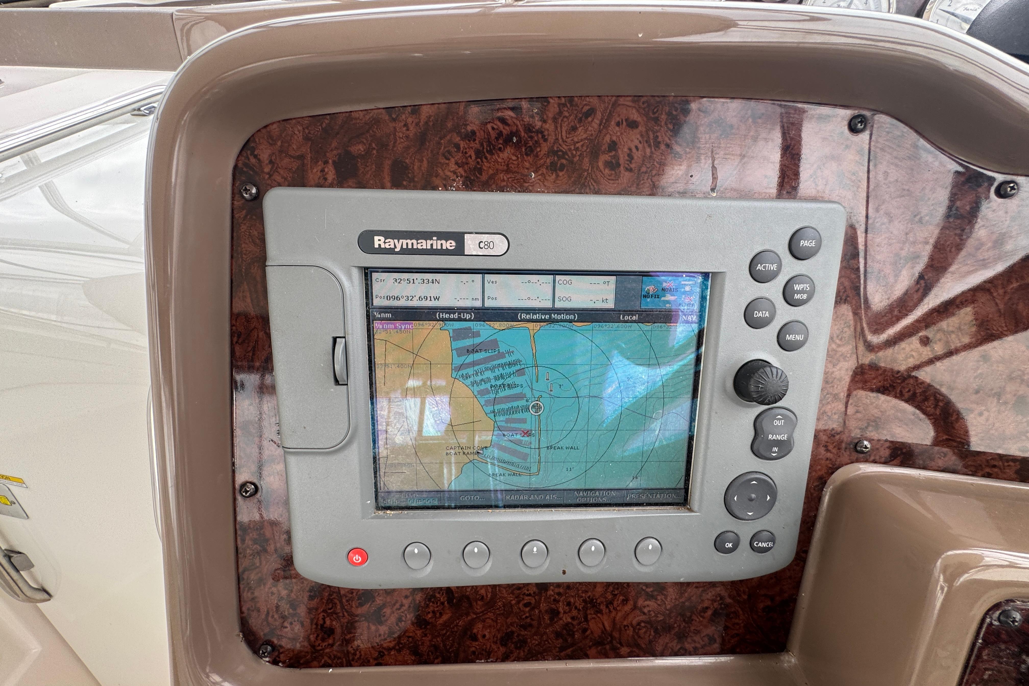 Raymarine C80 navigation system on 2005 Regal Commodore 4260 boat dashboard.