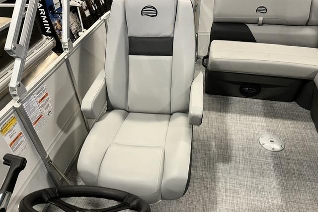2026 Sun Tracker Party Barge 20 DLX interior with gray captain's chair and seating.