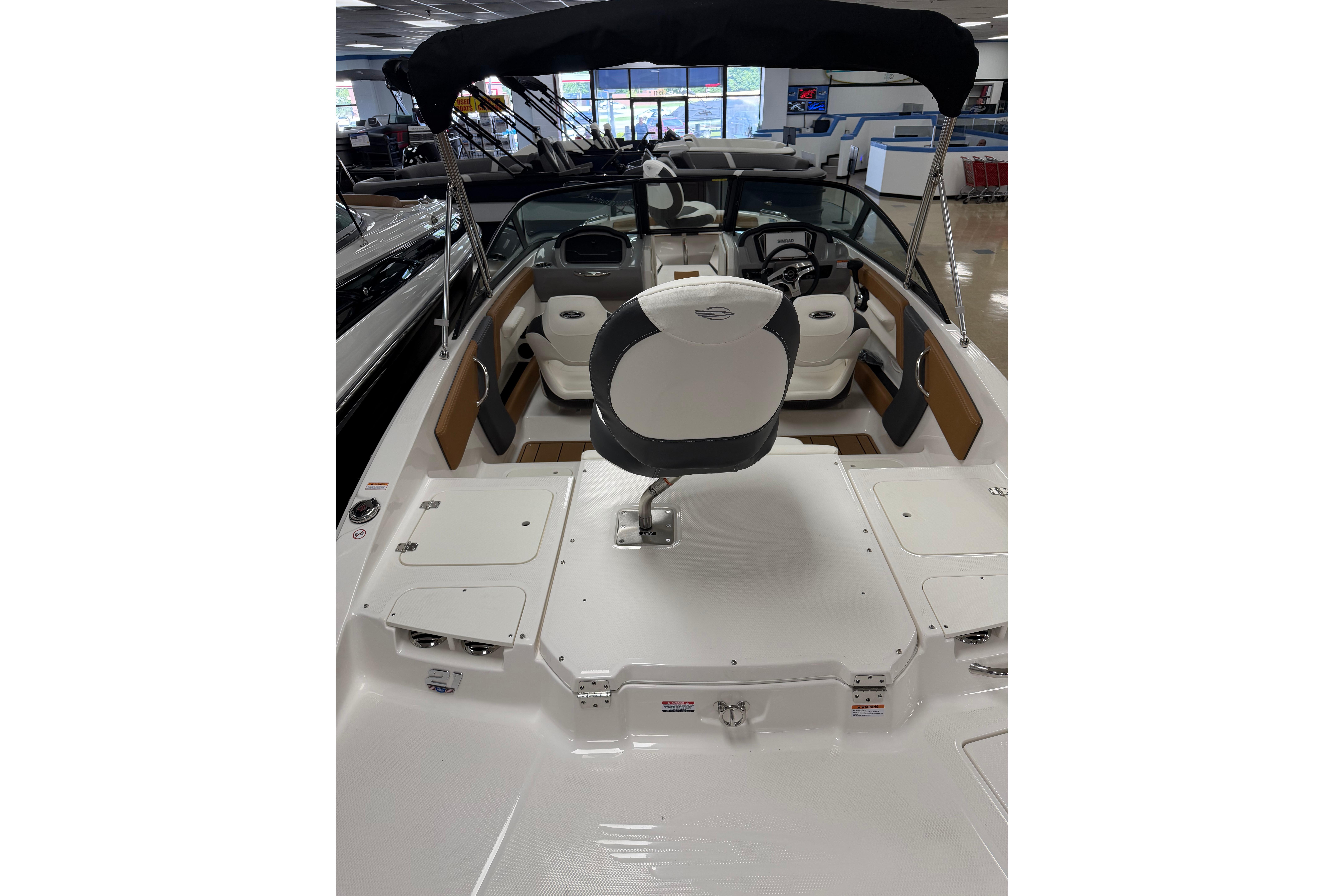 2026 Chaparral 21 SSi Ski & Fish boat interior with seating and steering wheel.