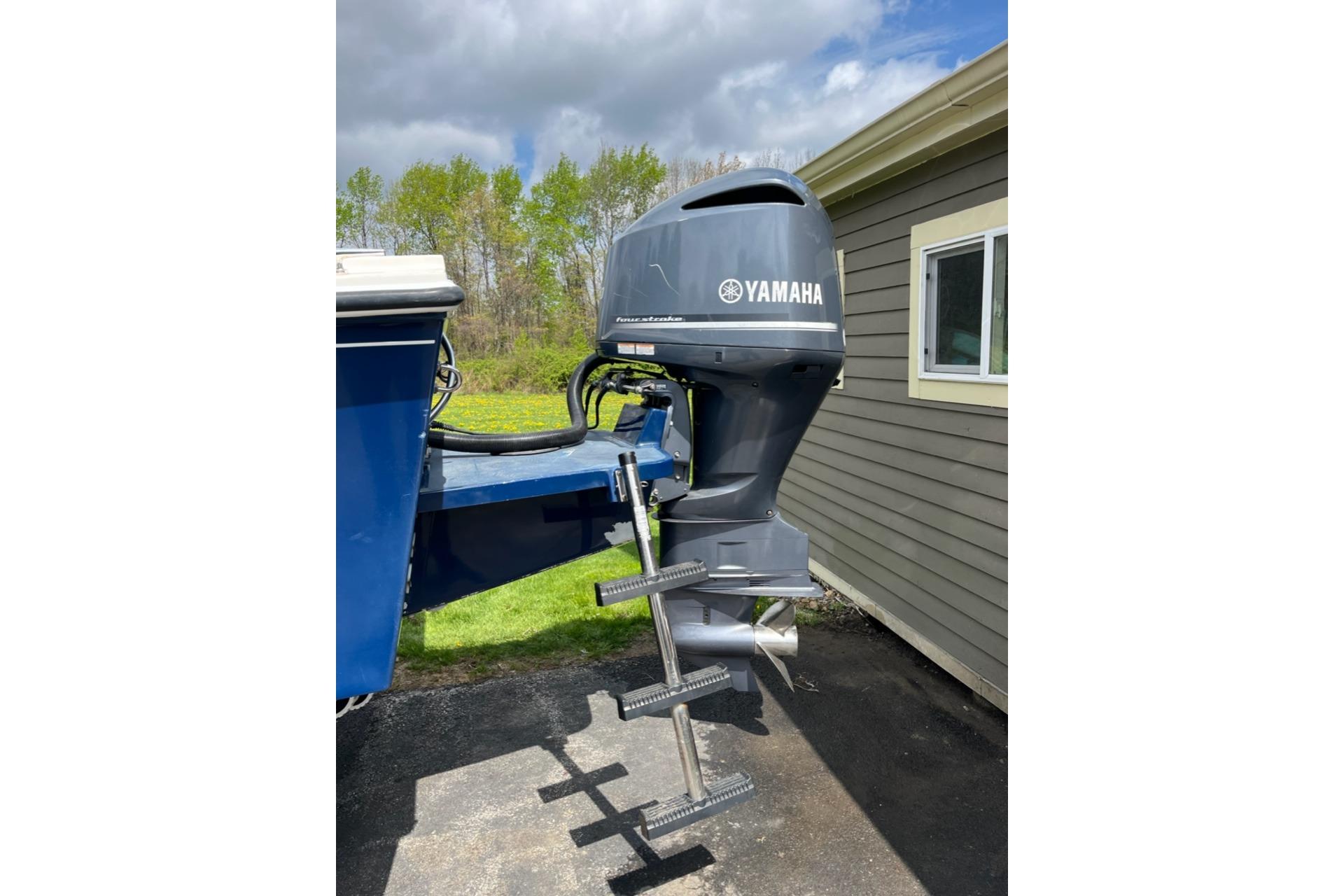 2012 Steiger Craft Miami boat with Yamaha outboard motor, parked outdoors.