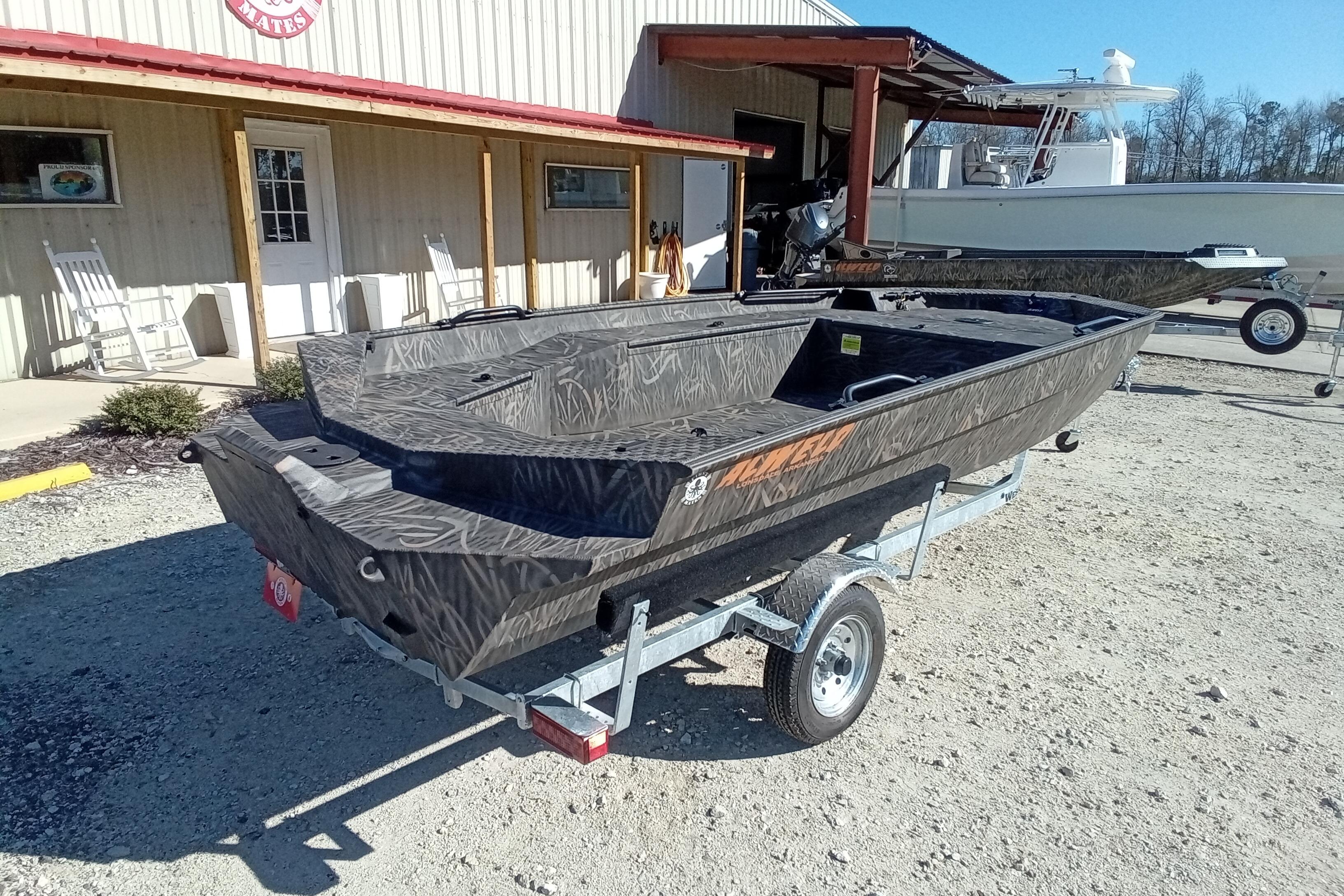 2026 Alweld 1756 Invader boat on trailer outside a building.