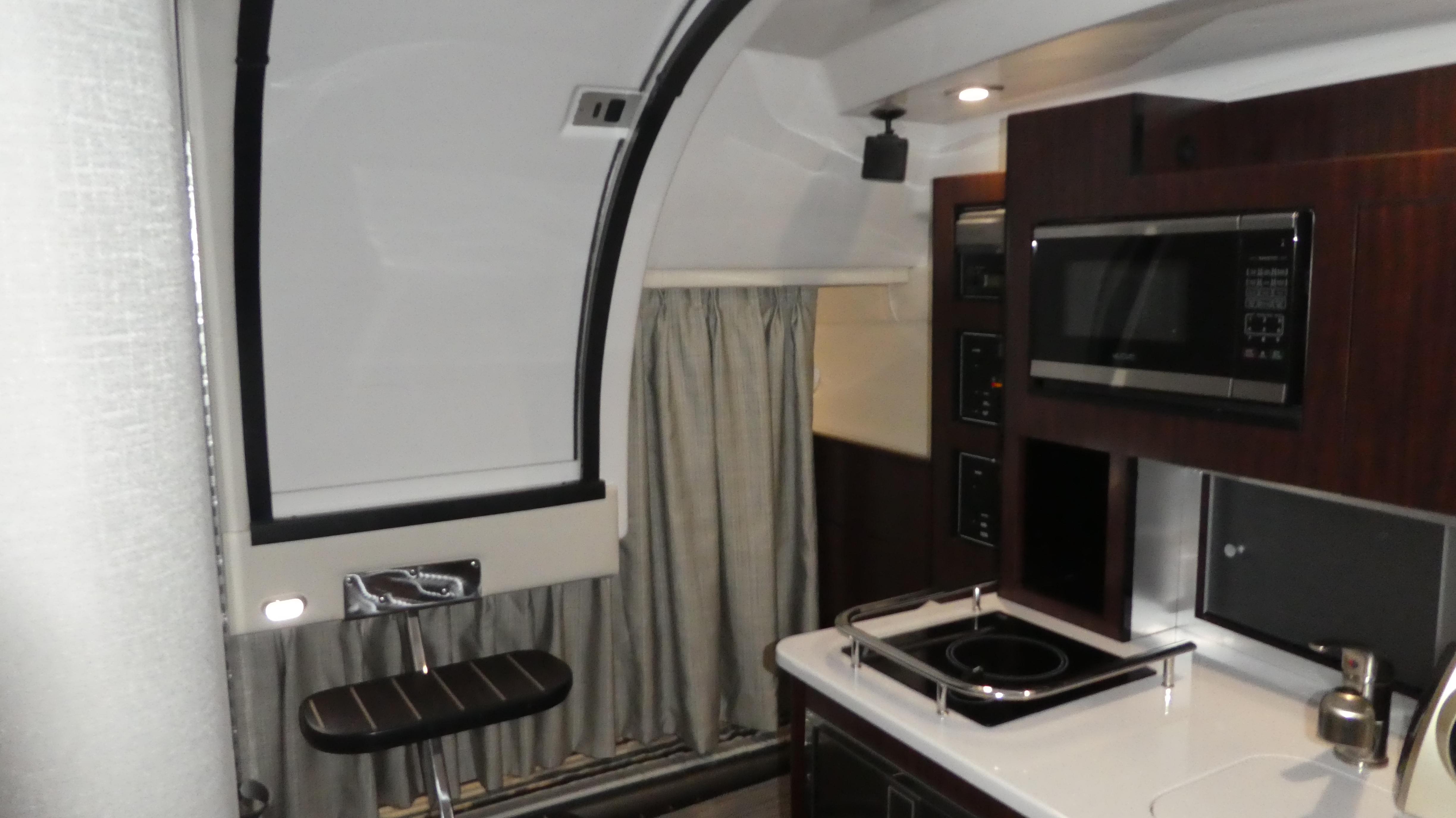 Interior of 2019 Monterey 295 Sport Yacht with modern kitchen.
