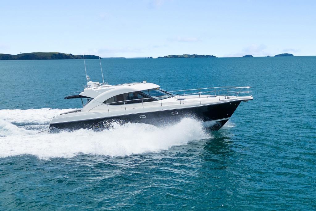 2007 Riviera 4700 Sport Yacht cruising on open water.
