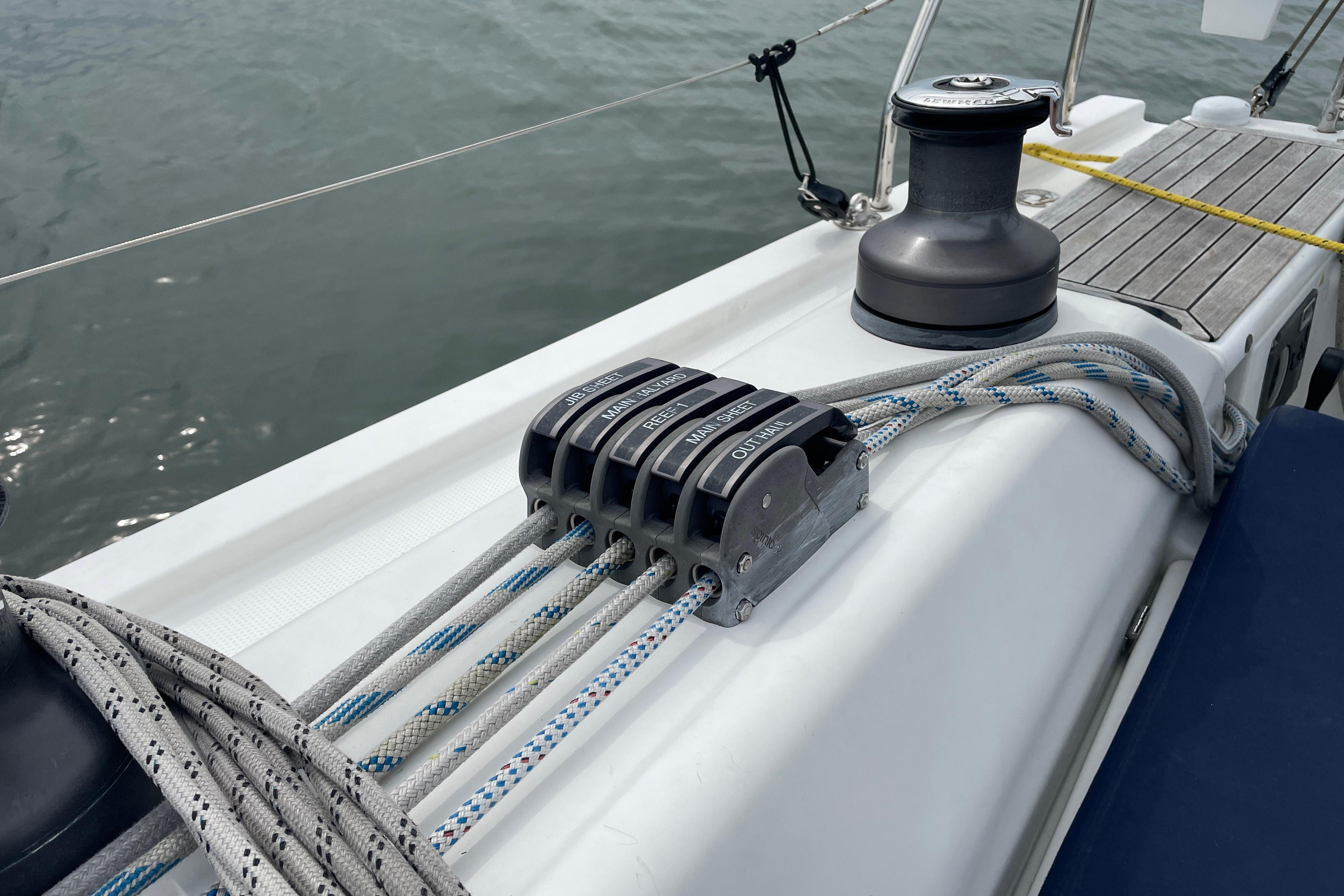 Deck of 2014 Hanse 415 sailboat with winch and rope clutches.