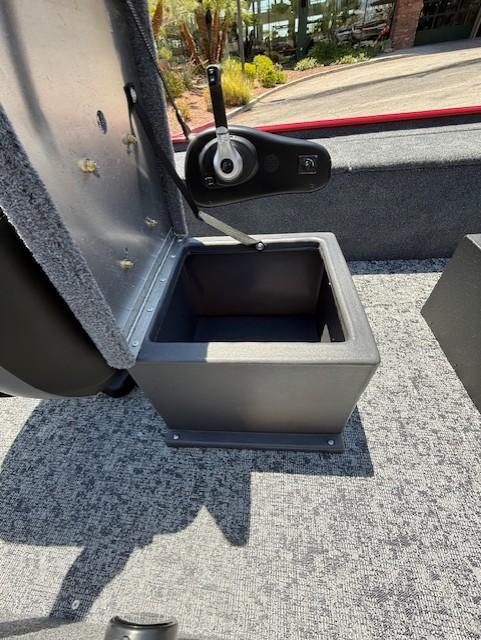 2025 Tracker Panfish 17 boat storage compartment with open lid, showcasing interior space.