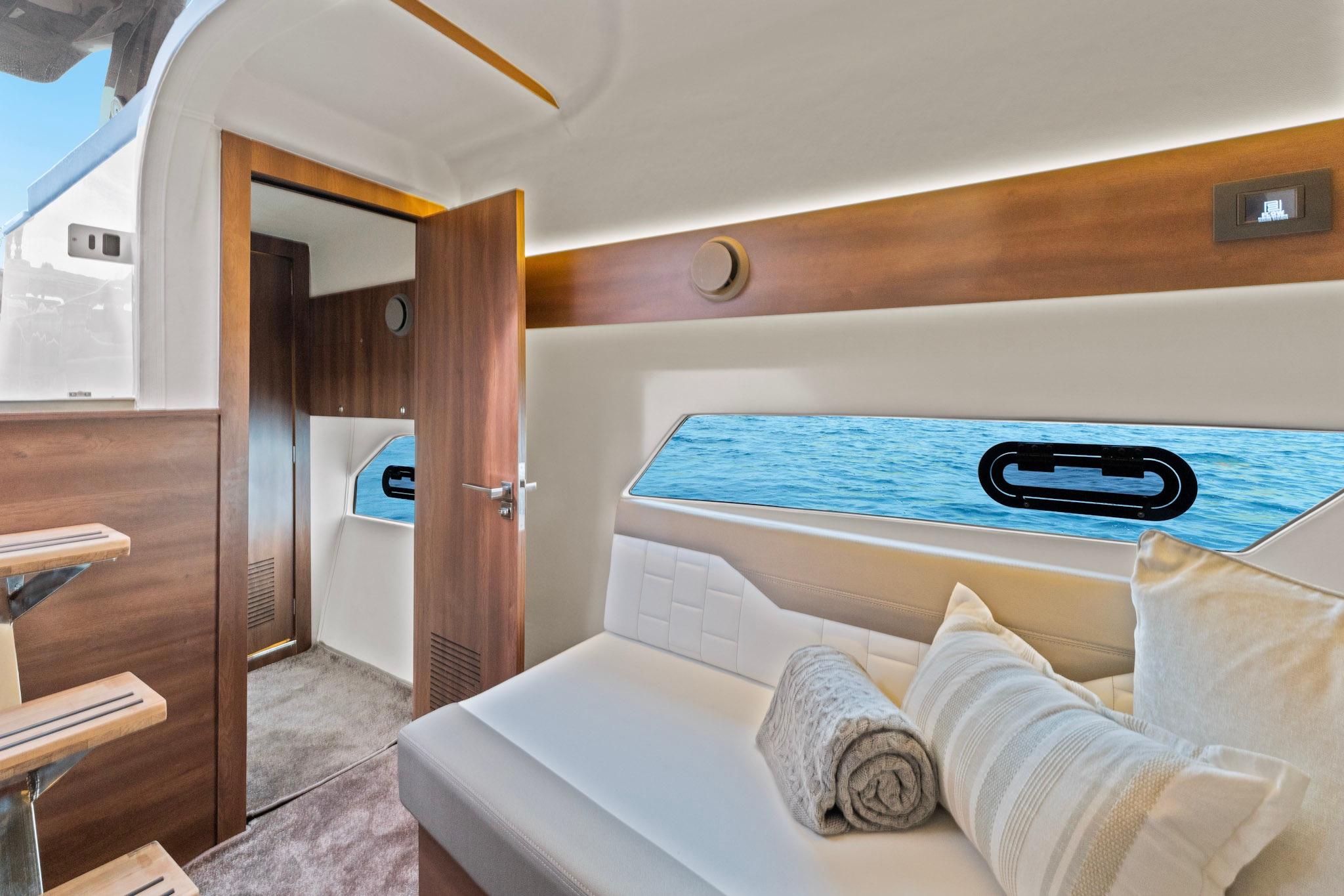 Luxurious interior of 2025 Valiatt 380GT yacht with elegant seating and ocean view.