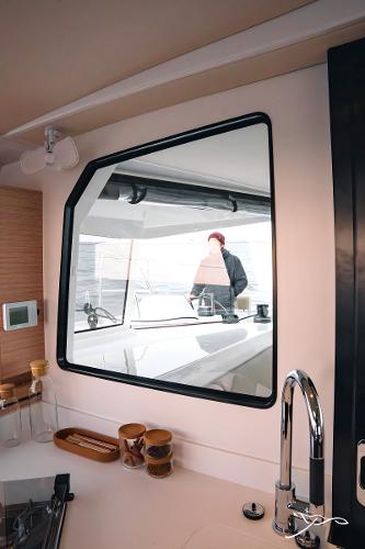 2025 Nautitech 40 Open yacht interior with modern kitchen and window view.