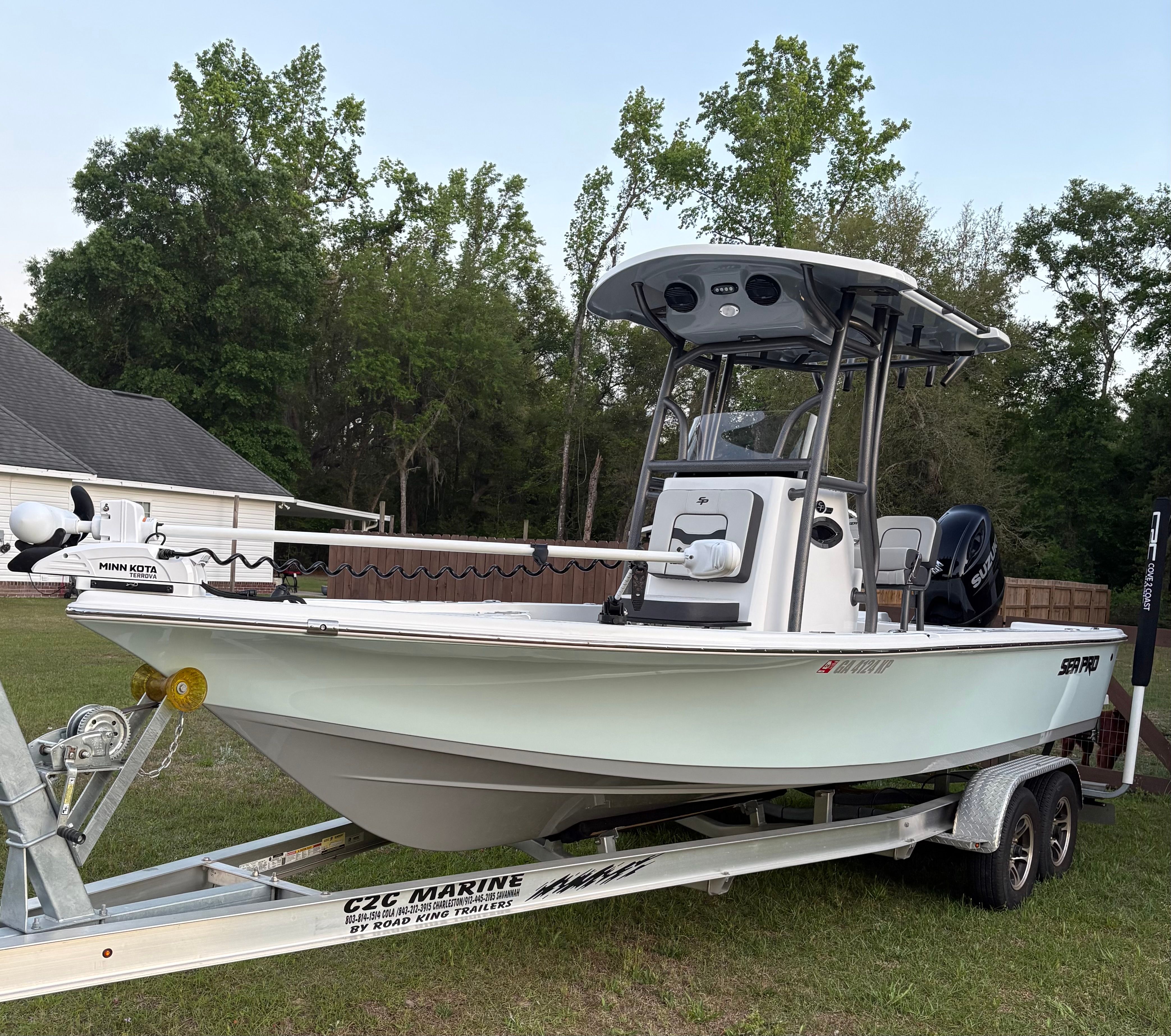 2025 Sea Pro 230 Bay boat on trailer outdoors.