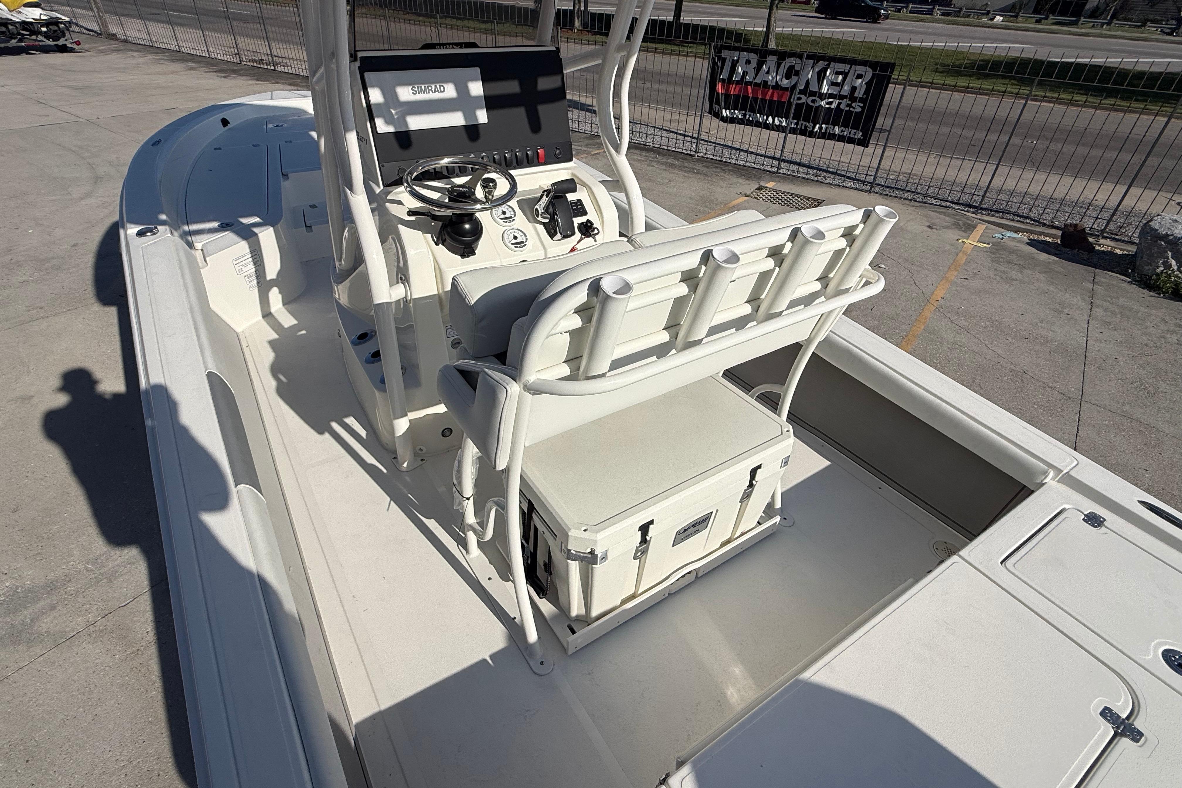 2026 Mako 24 APEX boat interior with steering console and seating.