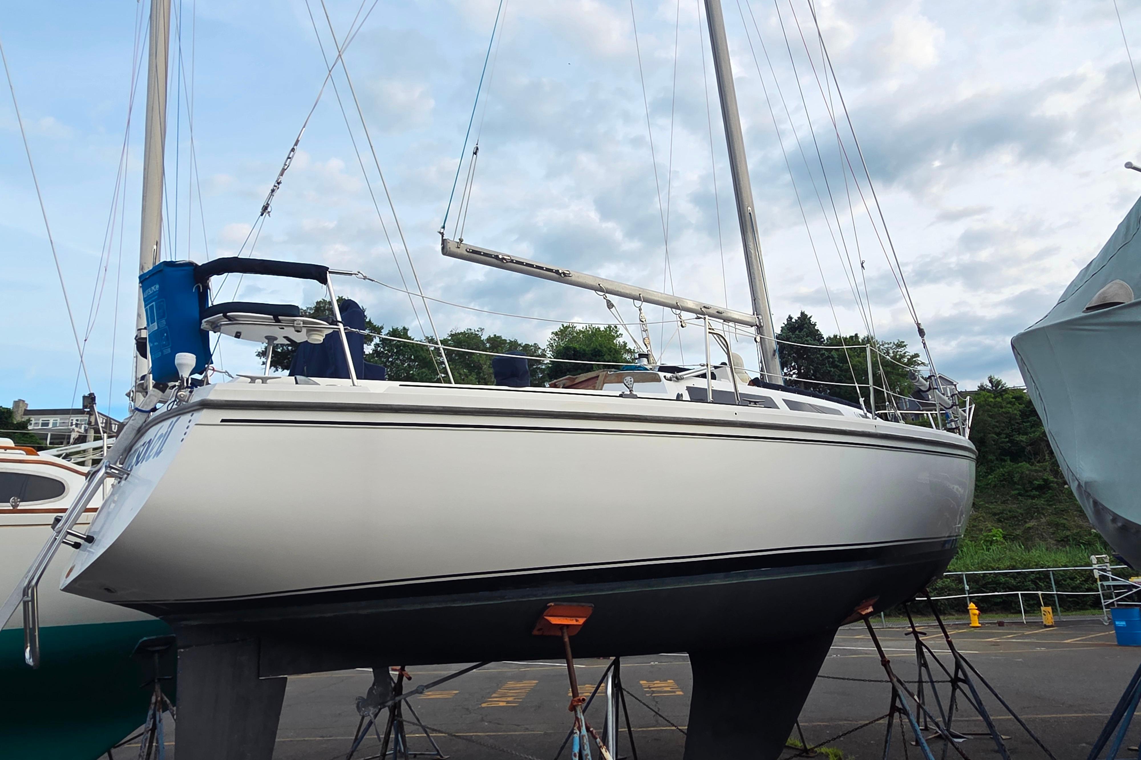 1986 Catalina 355 sailboat on stands, ready for maintenance in a boatyard.