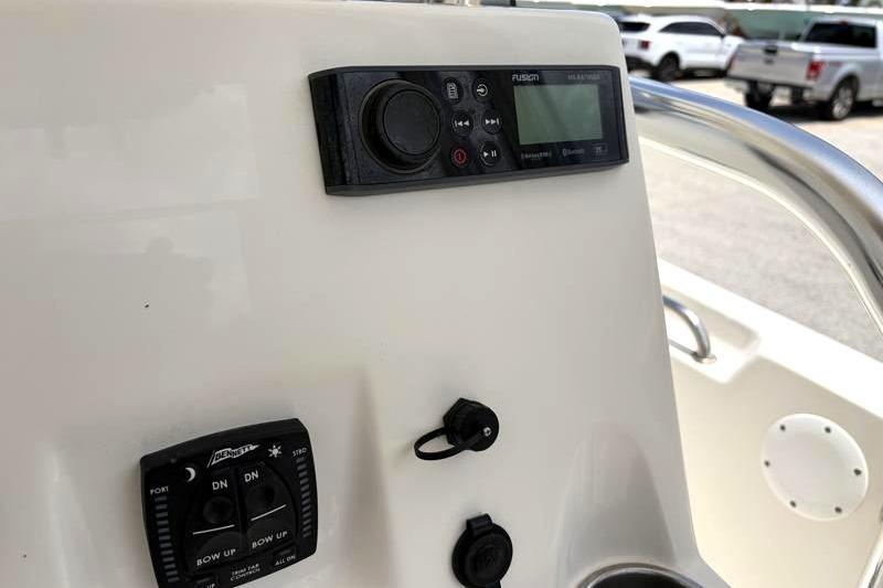 Control panel of 2023 Key West 203 FS boat with audio system and switches.