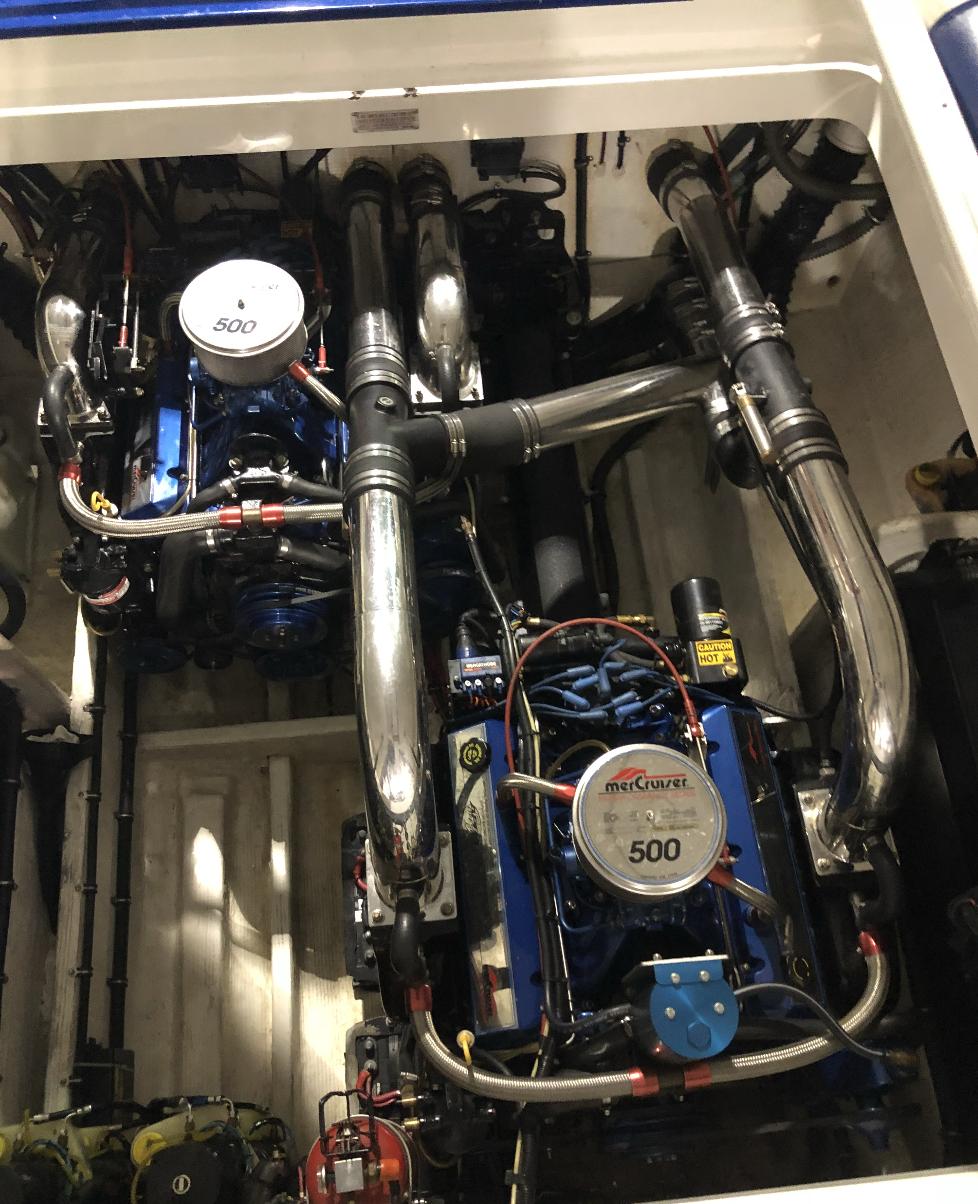 Engine compartment of a 1998 Fountain 42 Lightning boat, featuring dual Mercury 500 engines.