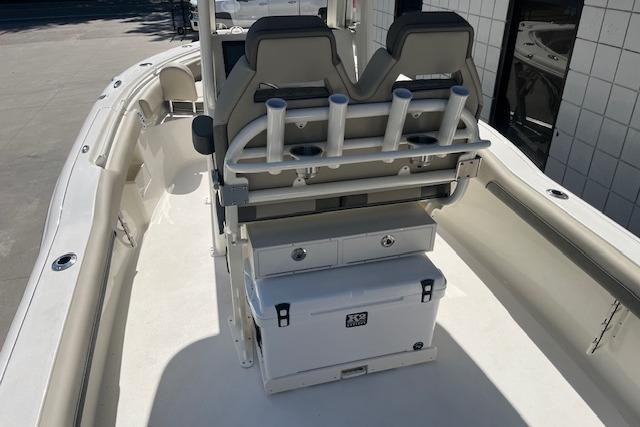 2026 Key West 239 FS boat interior with seating, rod holders, and storage compartments.