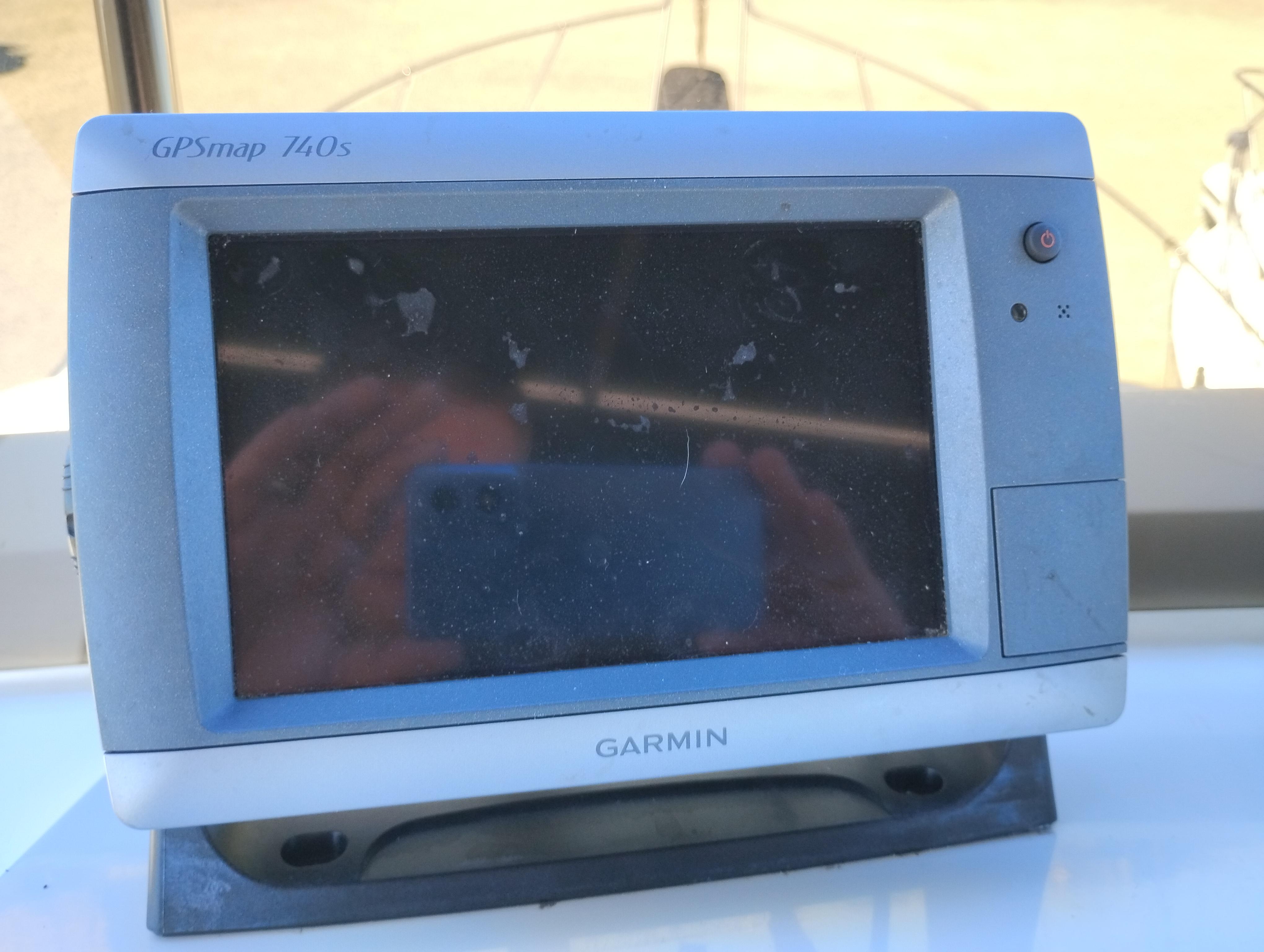 Garmin GPSmap 740s device on a 1978 Bertram 33 Convertible boat dashboard.
