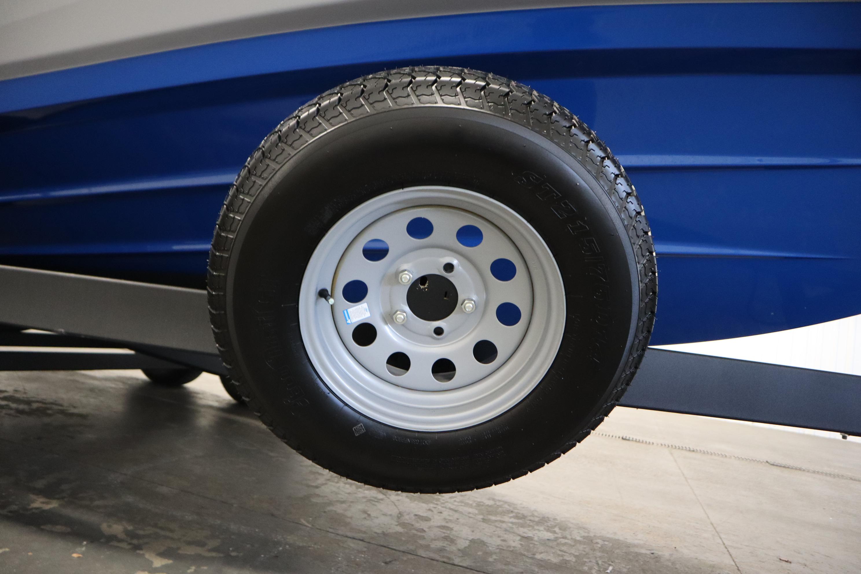 2026 Yamaha Boats AR220 trailer wheel and blue hull detail.