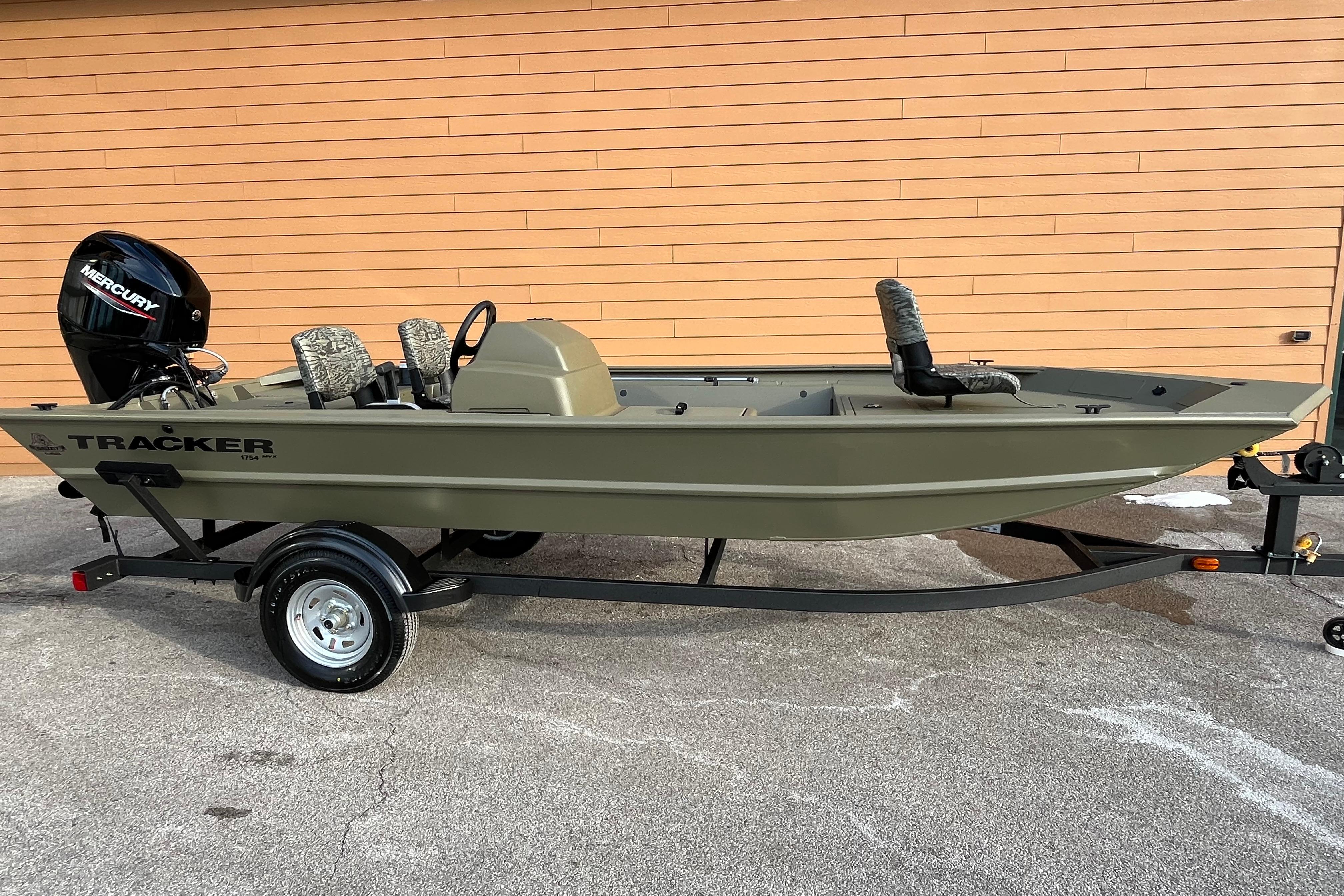 2026 Tracker Grizzly 1754 SC boat on trailer, featuring Mercury outboard motor.