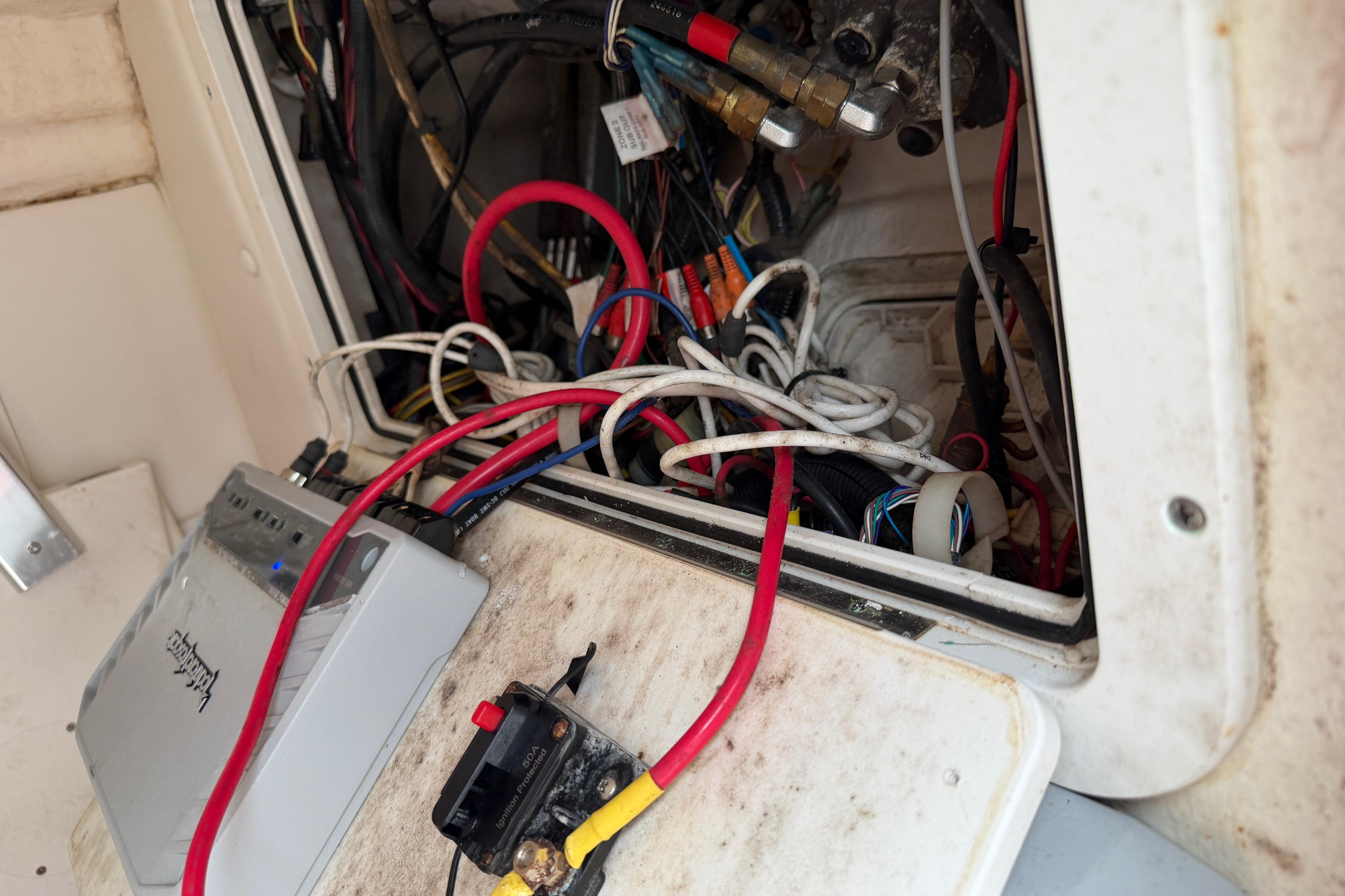Electrical wiring and components inside a 2019 World Cat 230 DC boat.
