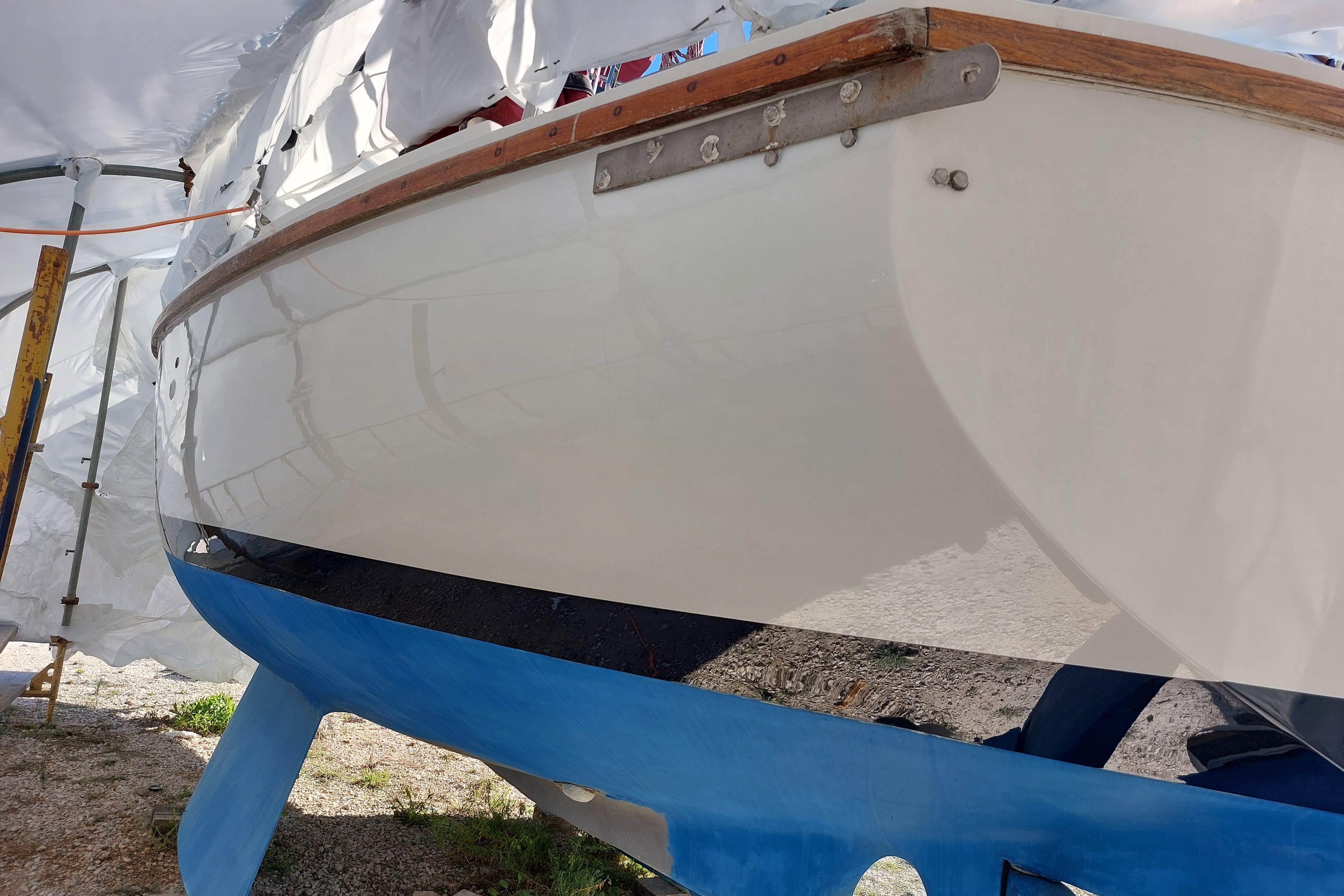 1978 Westerly 33 sailboat under maintenance, featuring a clean white hull and blue keel.