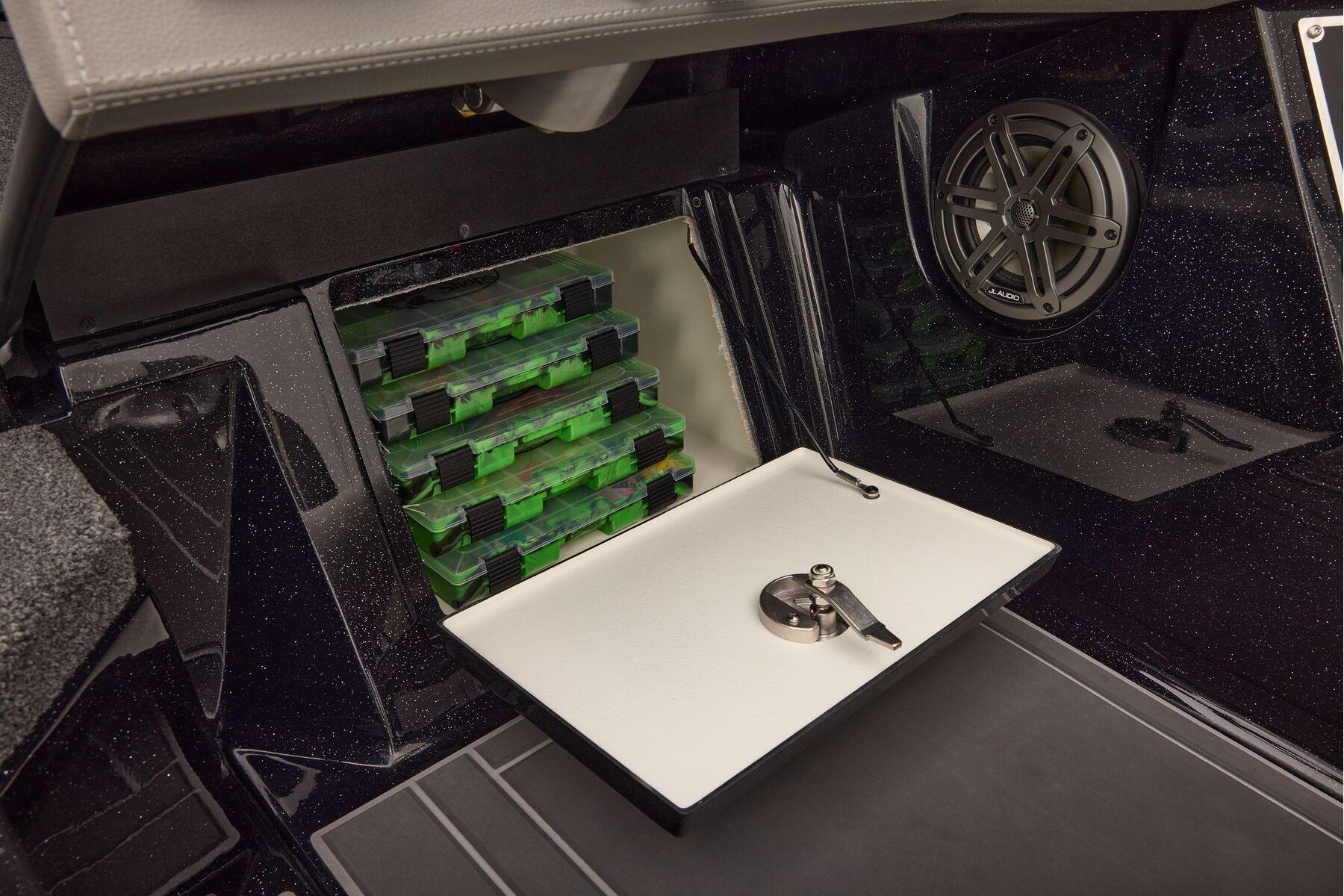 Manufacturer Provided Image: Interior storage of 2026 Ranger 620xFS Pro boat with tackle boxes and speaker.