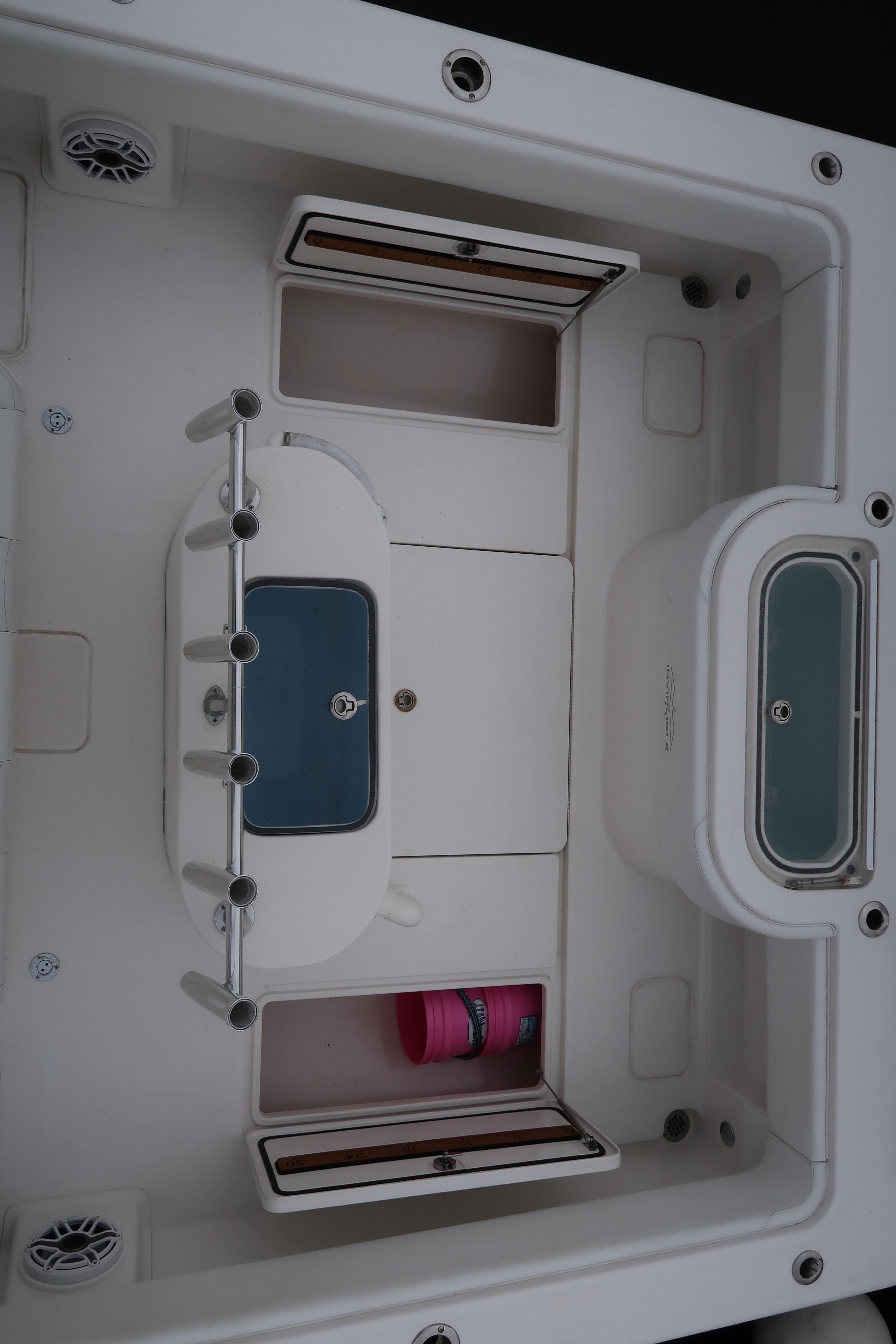 2016 Invincible 42 Open Fisherman boat interior with storage compartments and rod holders.