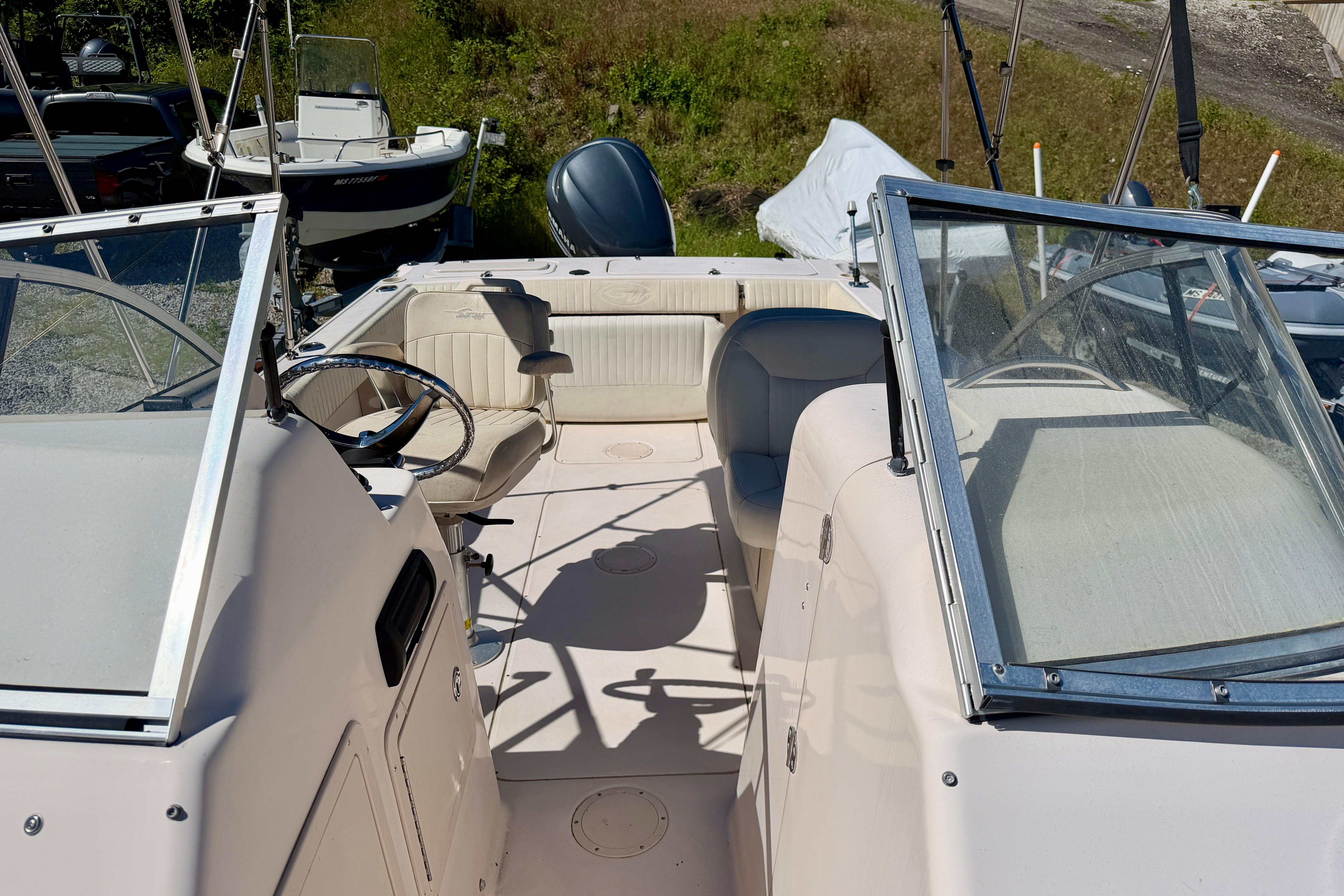 2005 Grady-White Freedom 225 boat interior with steering wheel and seating.