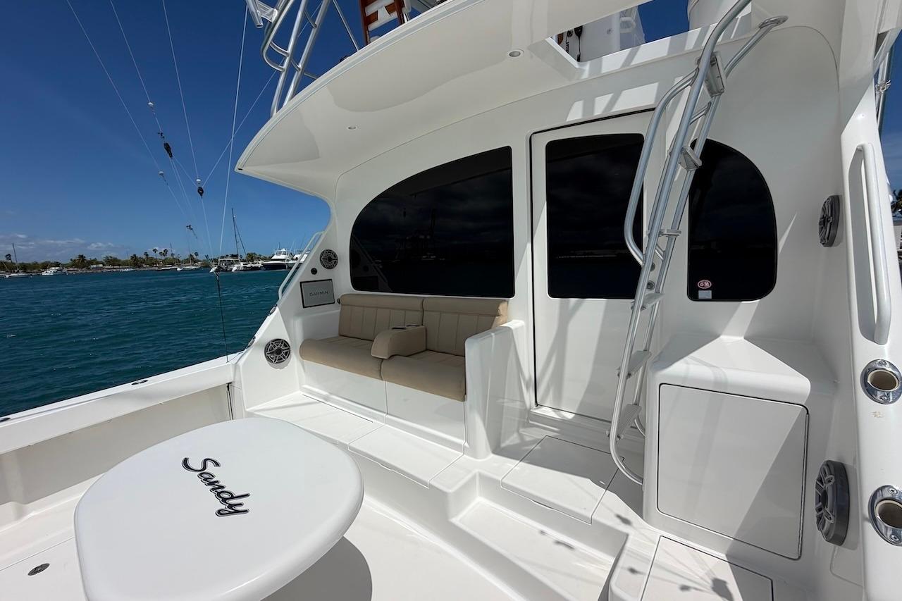 2012 Viking 50 Convertible yacht deck with seating and ocean view.