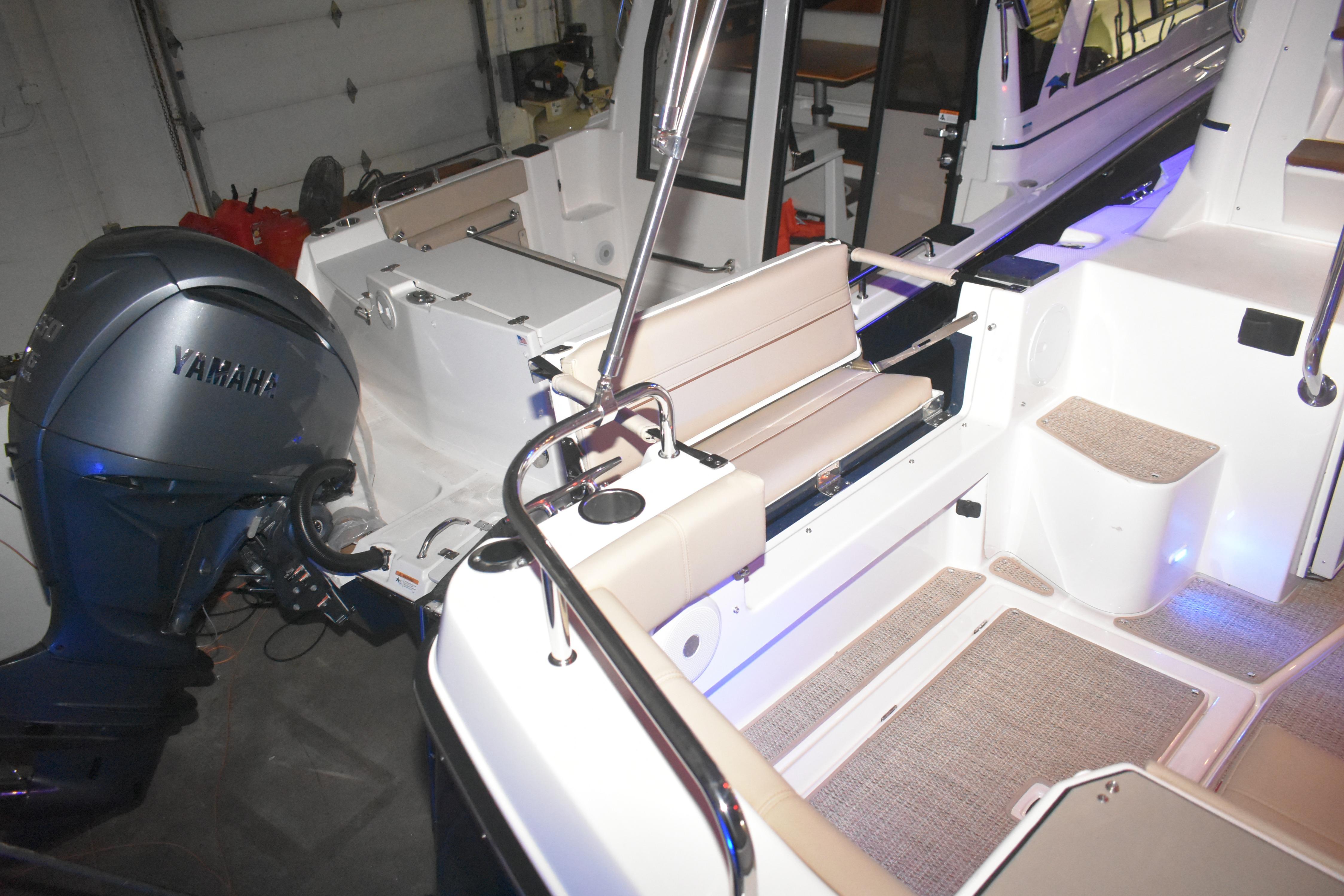 2026 Cutwater C-32 CB boat interior with Yamaha engine, featuring seating and modern design.