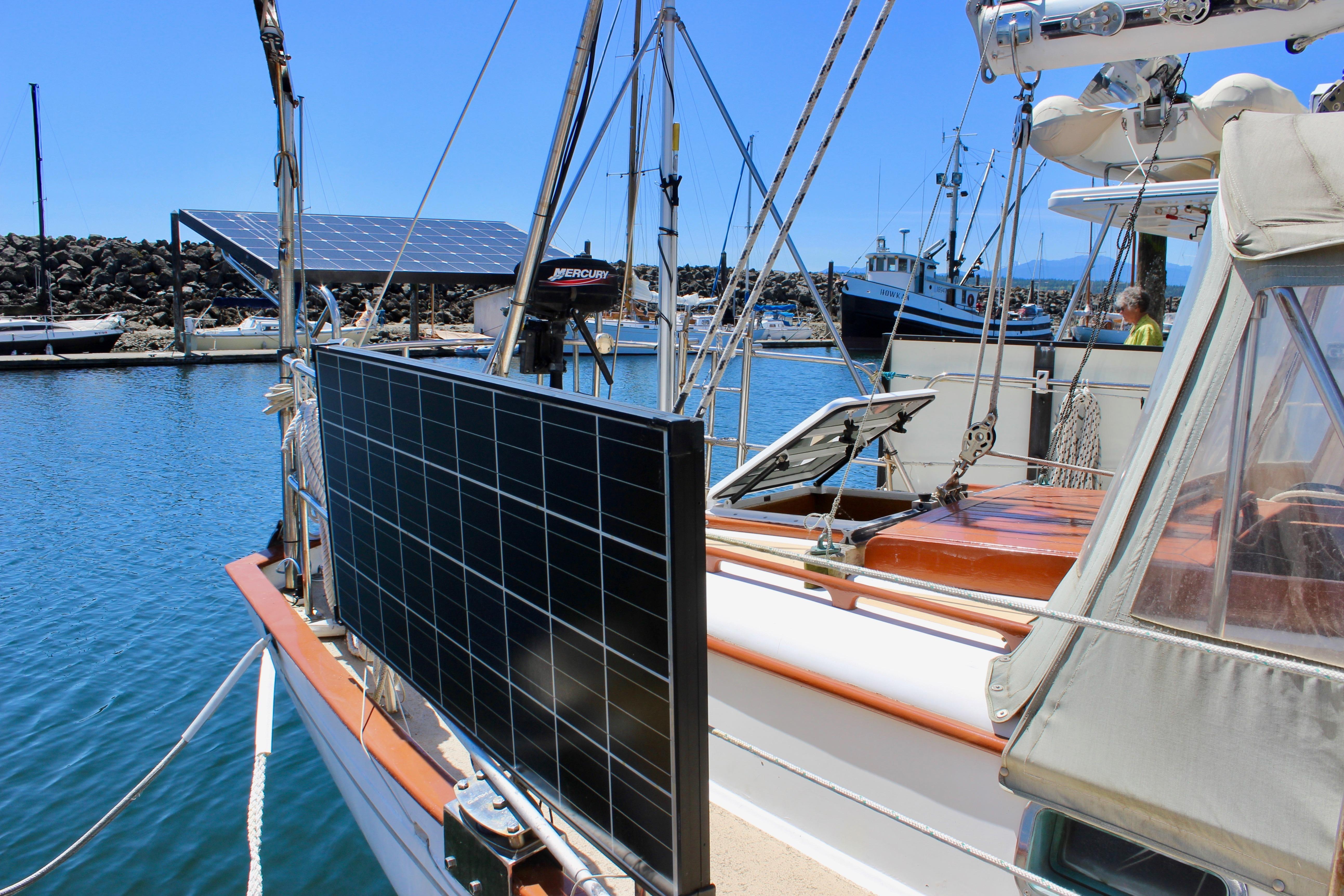 Sailboat with solar panels docked in a marina, Kelly Peterson 46, 1981 model.