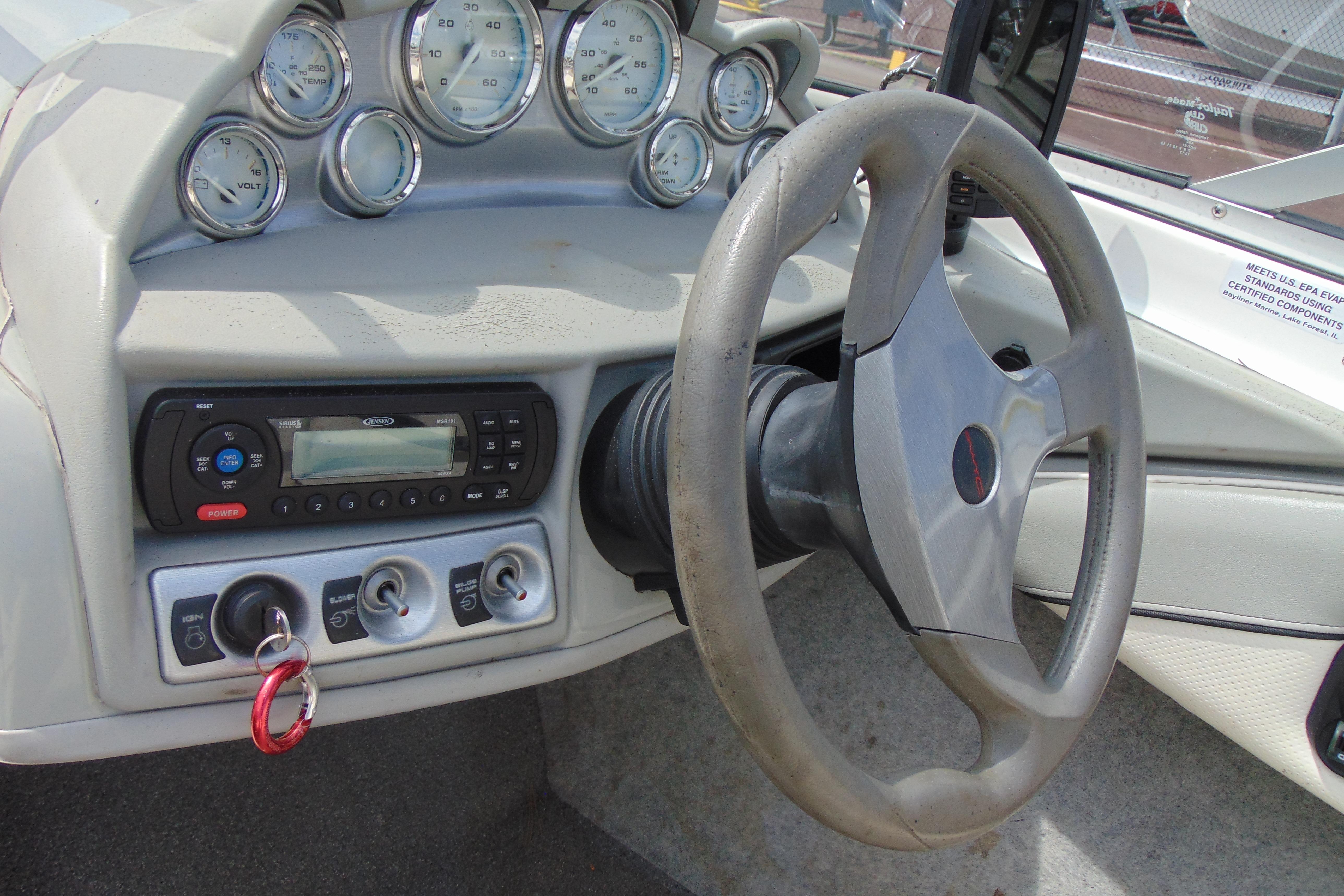 2012 Bayliner 185 Bowrider dashboard with steering wheel and control panel.