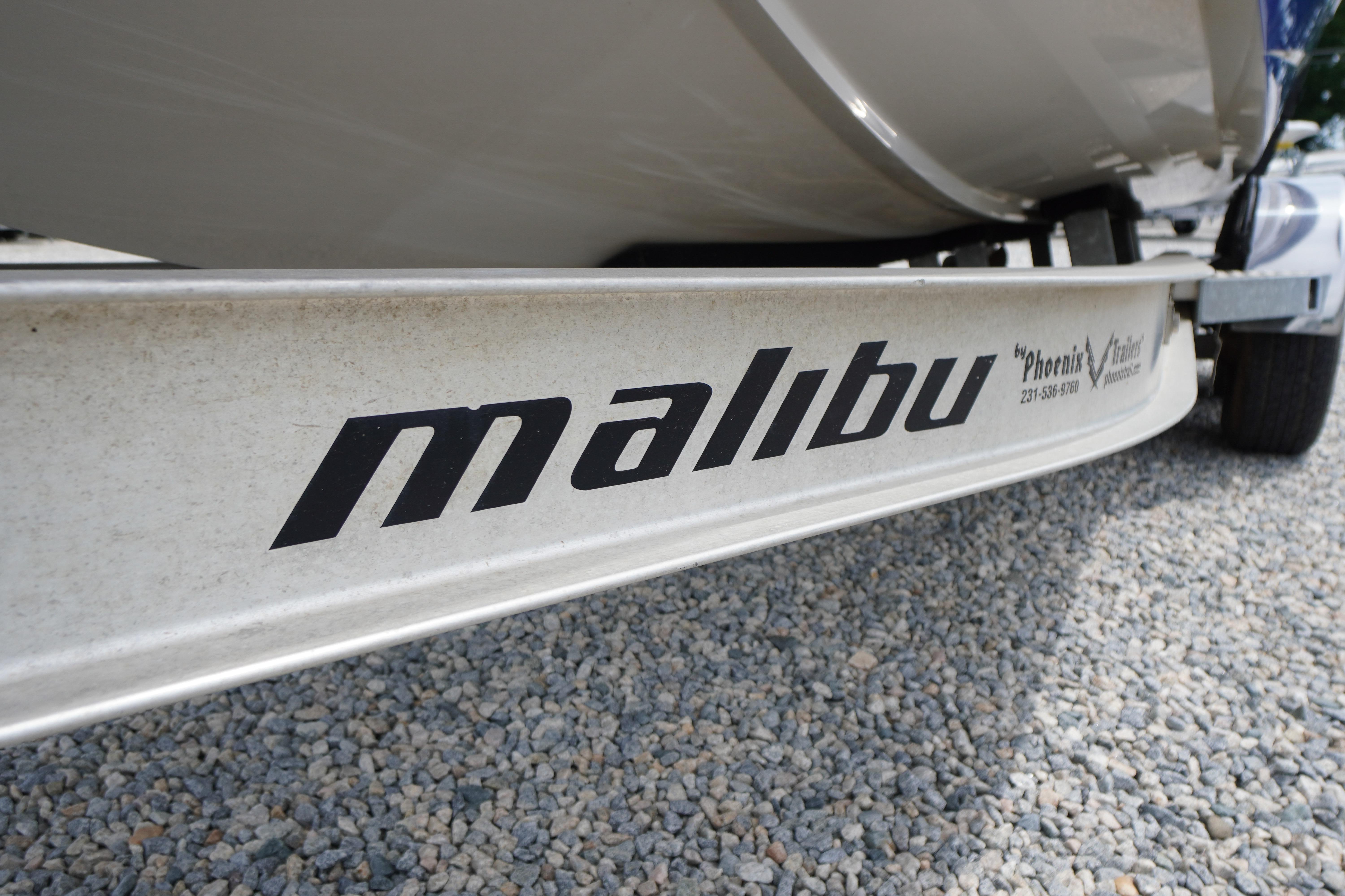2011 Malibu Wakesetter 21 VLX trailer on gravel surface.