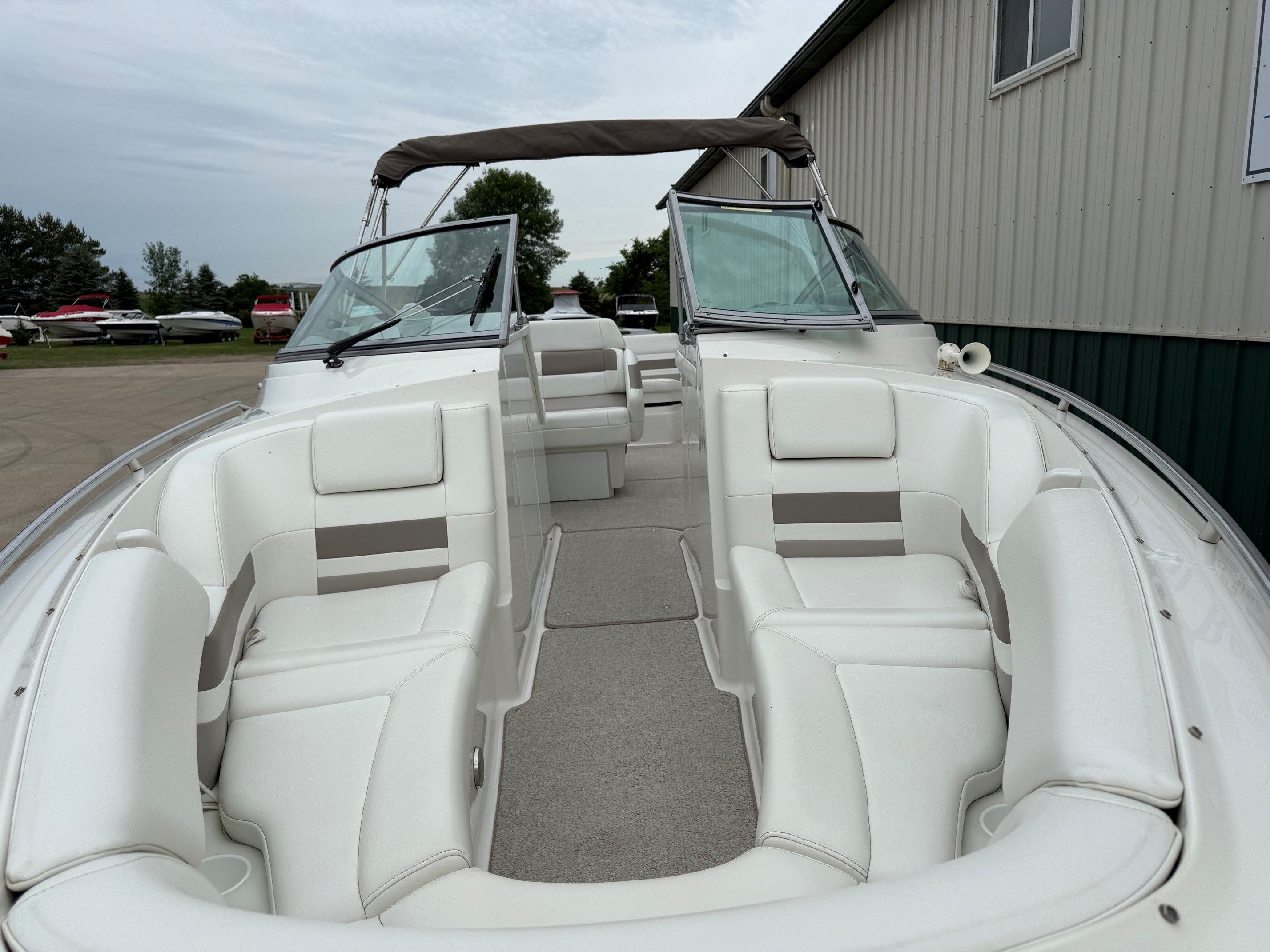 Interior of a 1998 Formula Thunderbird boat with white seating.