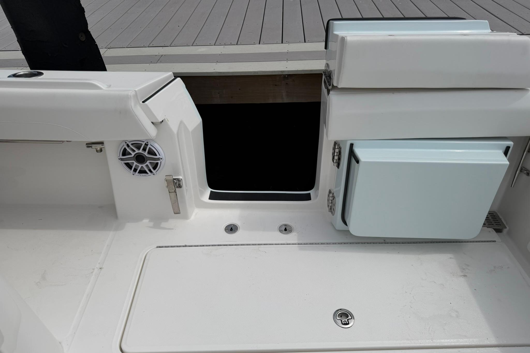 2026 Regulator 37 boat interior with storage compartments and speaker.