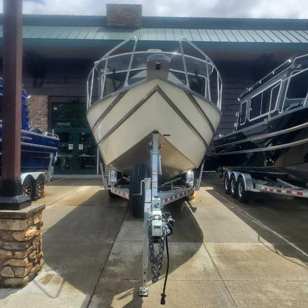 2024 Spartan 2600 Olympia boat on trailer, front view, displayed outdoors.