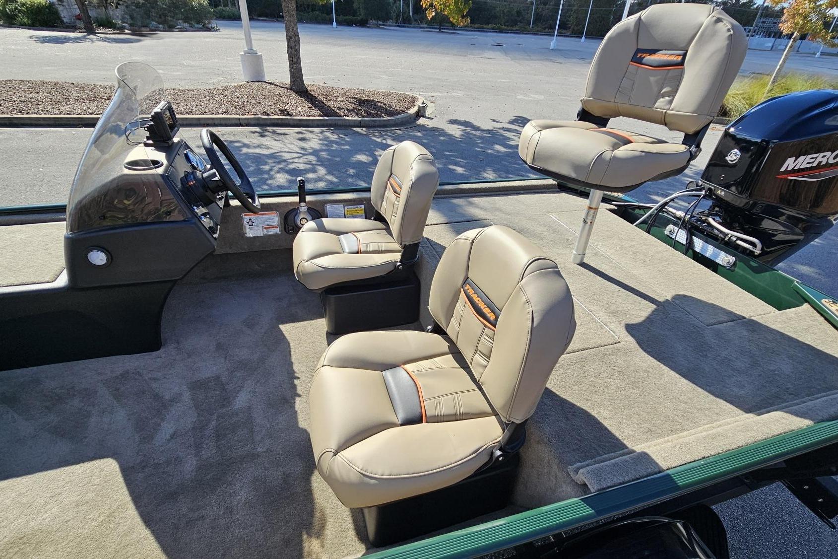 2026 Tracker Bass Tracker Classic Limited boat interior with beige seats and steering console.