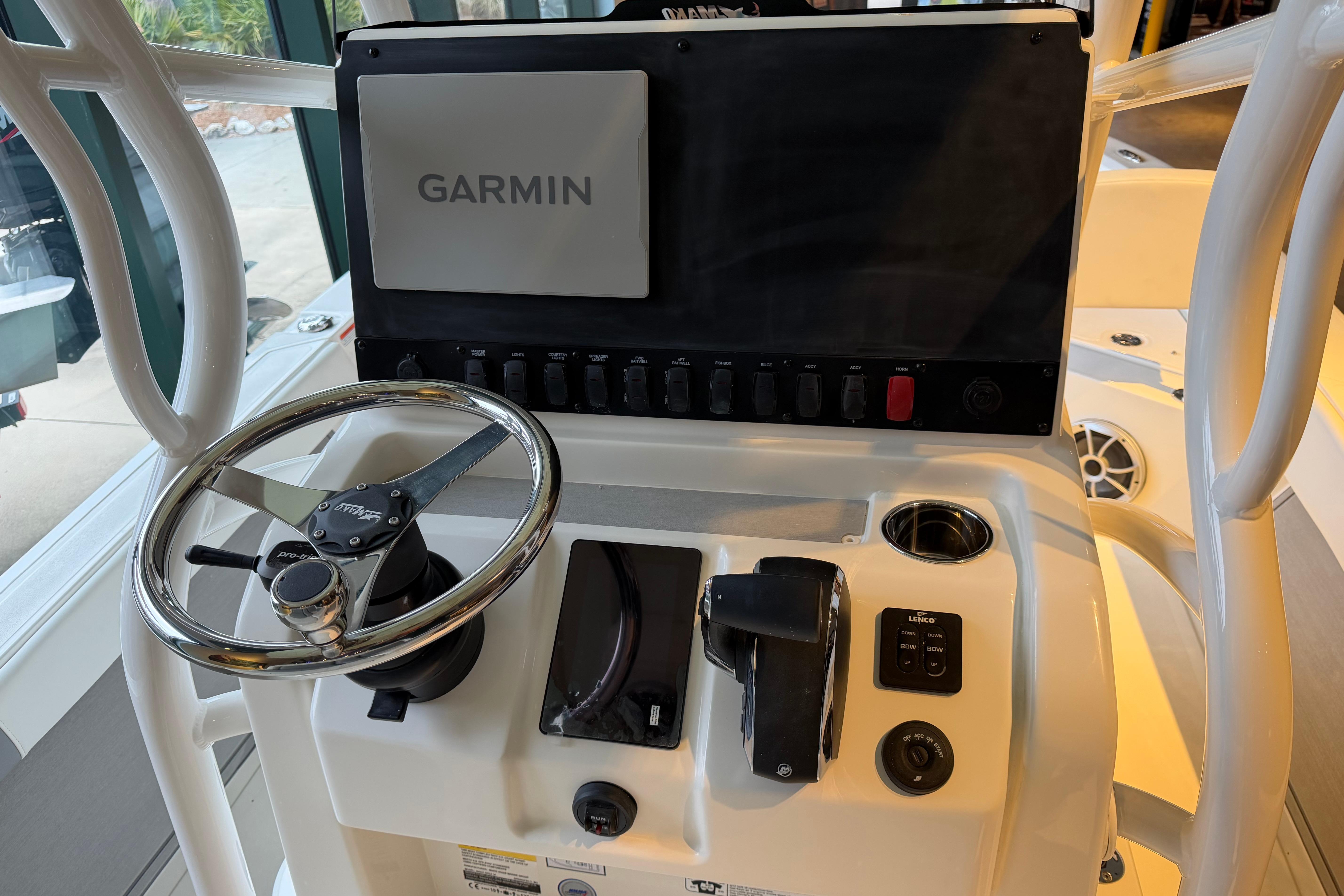 Steering console of 2026 Mako 24 APEX boat with Garmin navigation system.