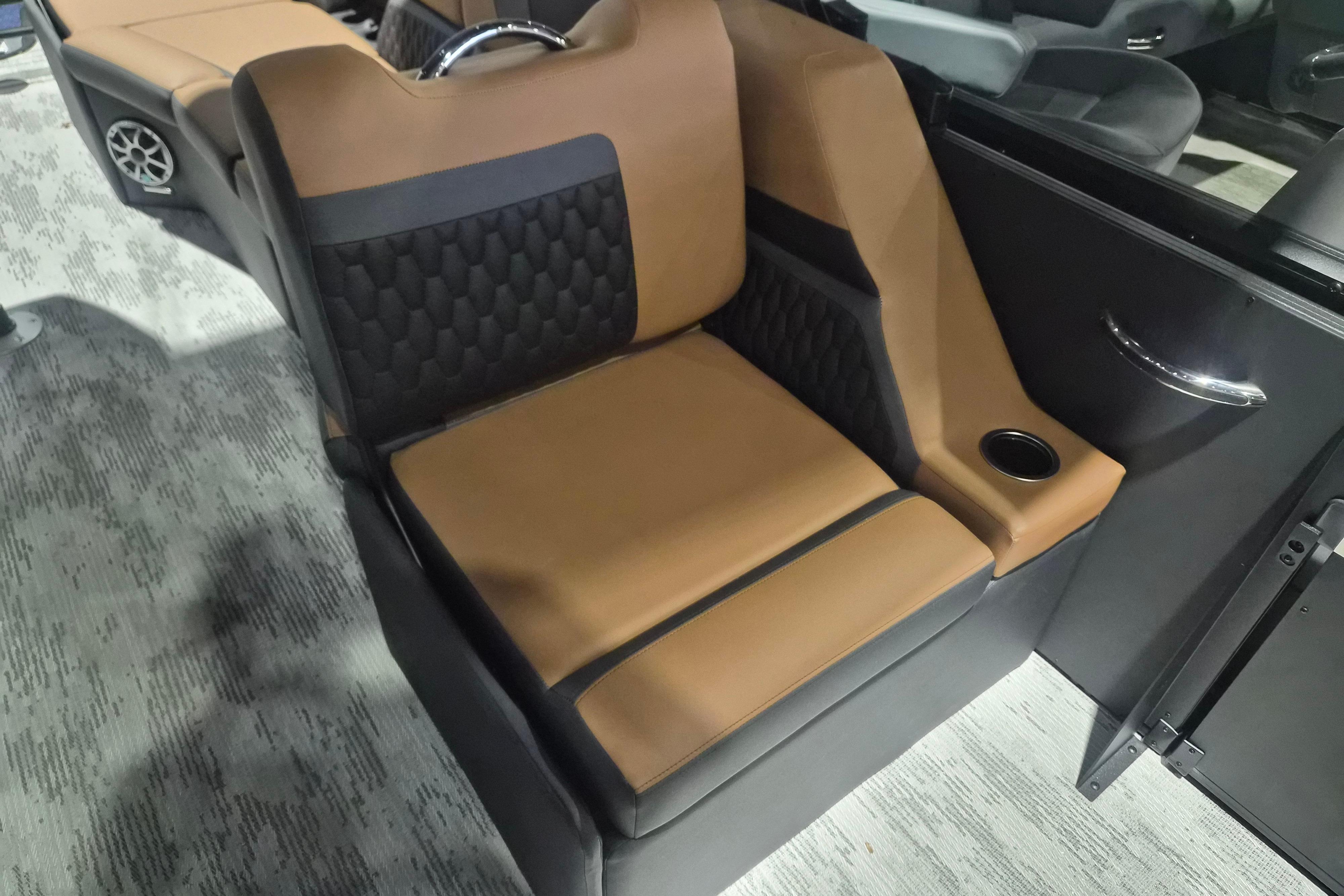 Luxurious seating in the 2026 Sylvan L3 SLZ boat, featuring brown and black upholstery.